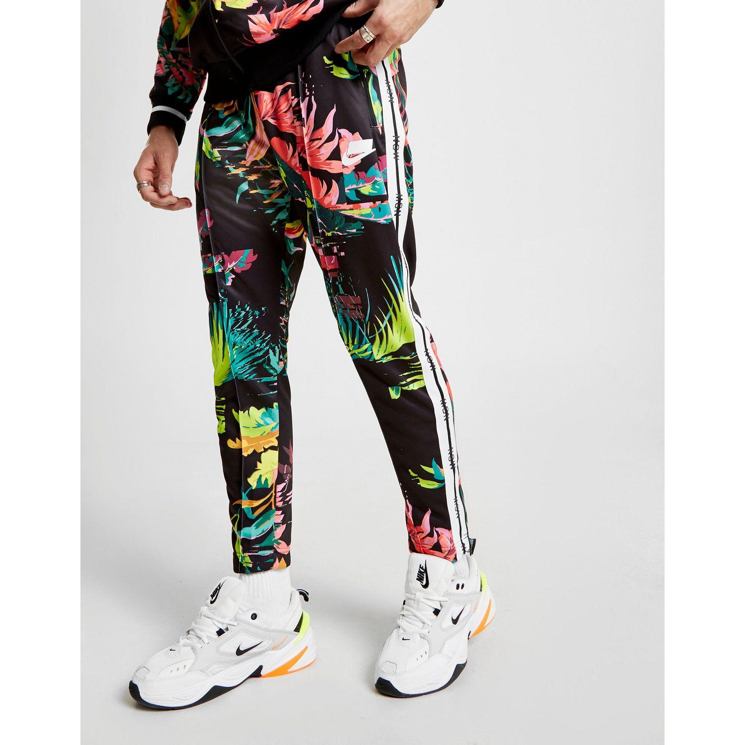 nike sportswear all over print track pants