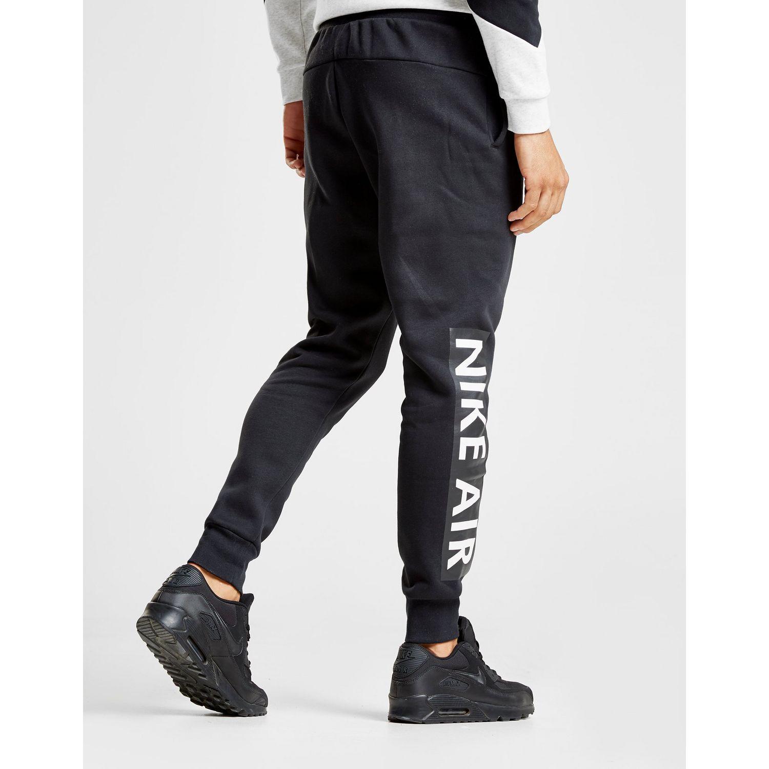 nike air logo track pants grey