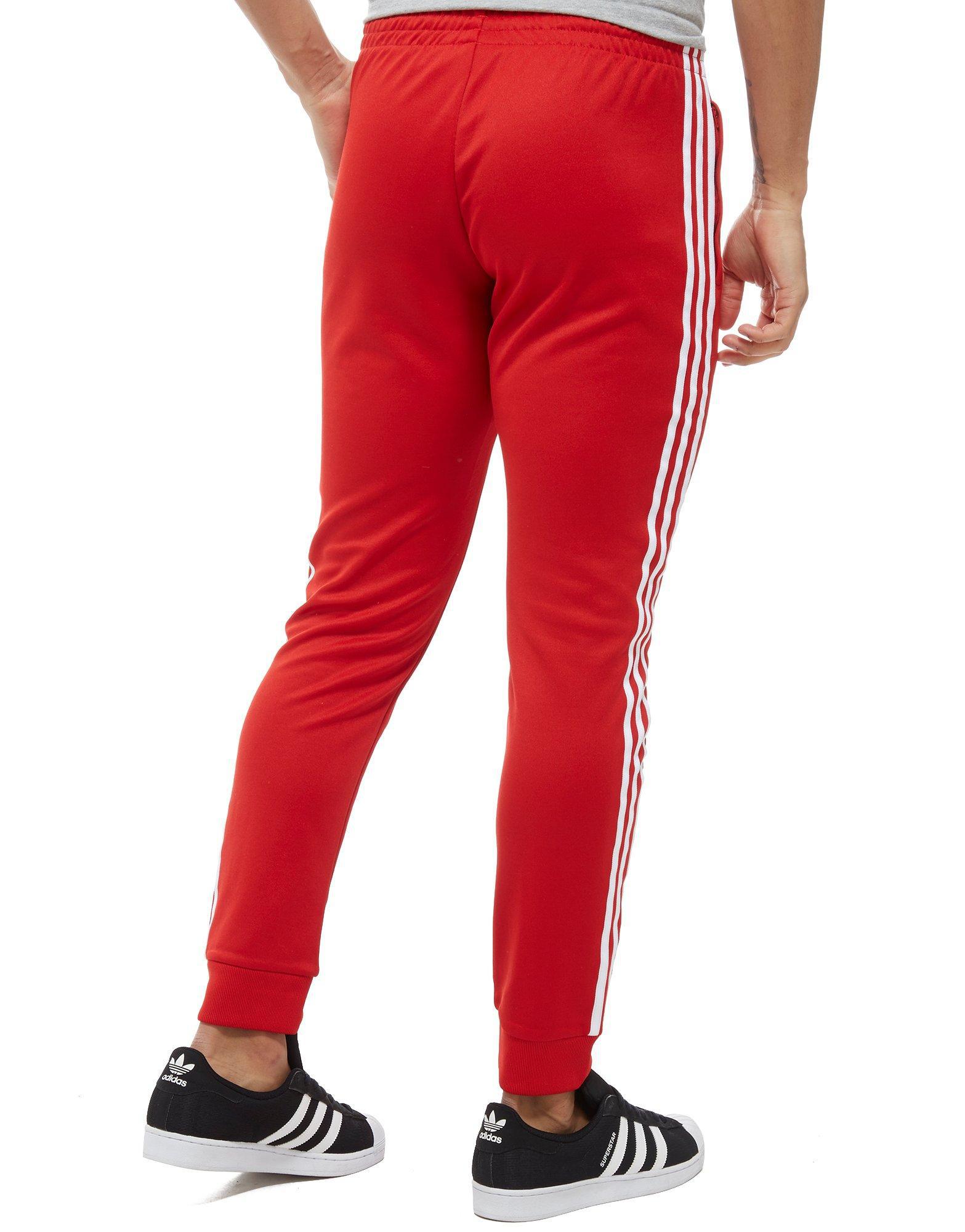 adidas superstar track pants red