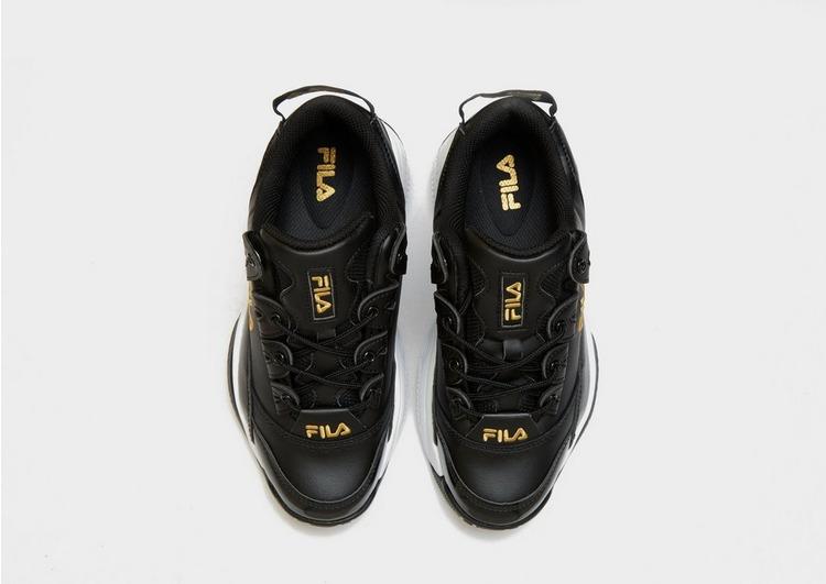 black and gold fila trainers