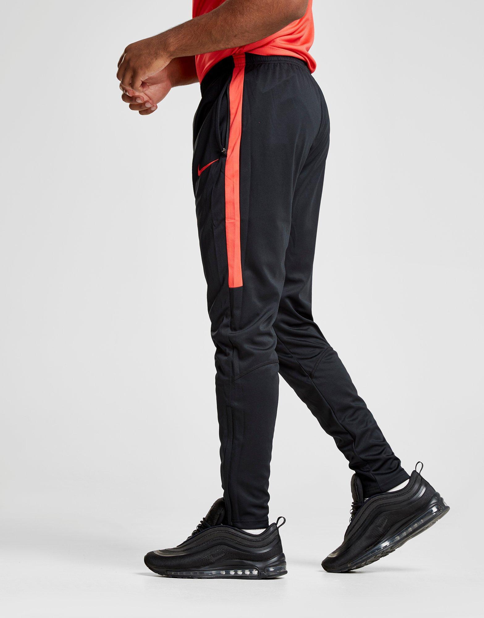 red and black nike pants