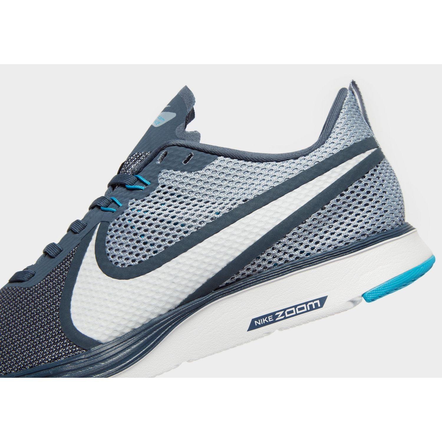 blue and white nike zoom