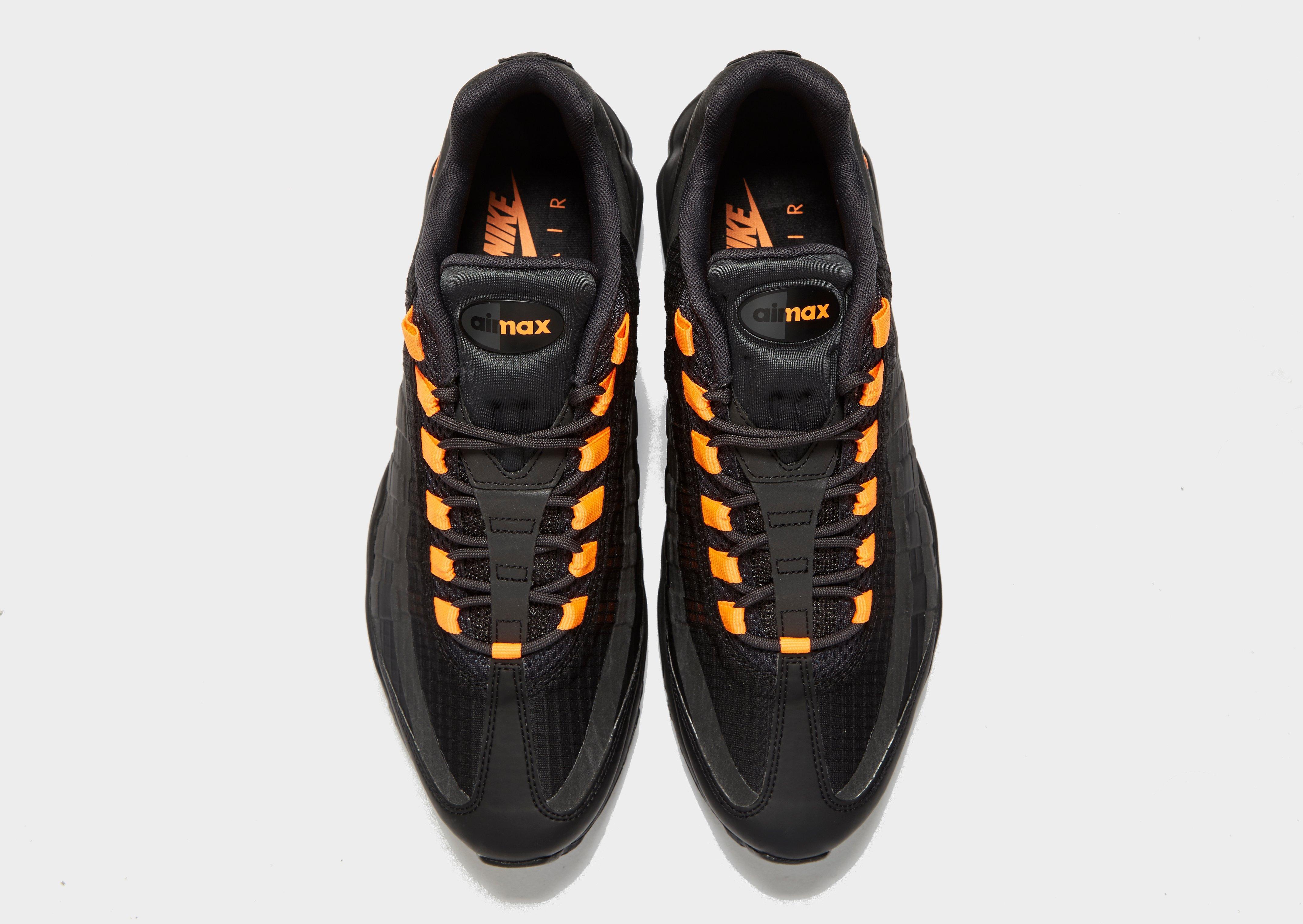 black and orange nike 95