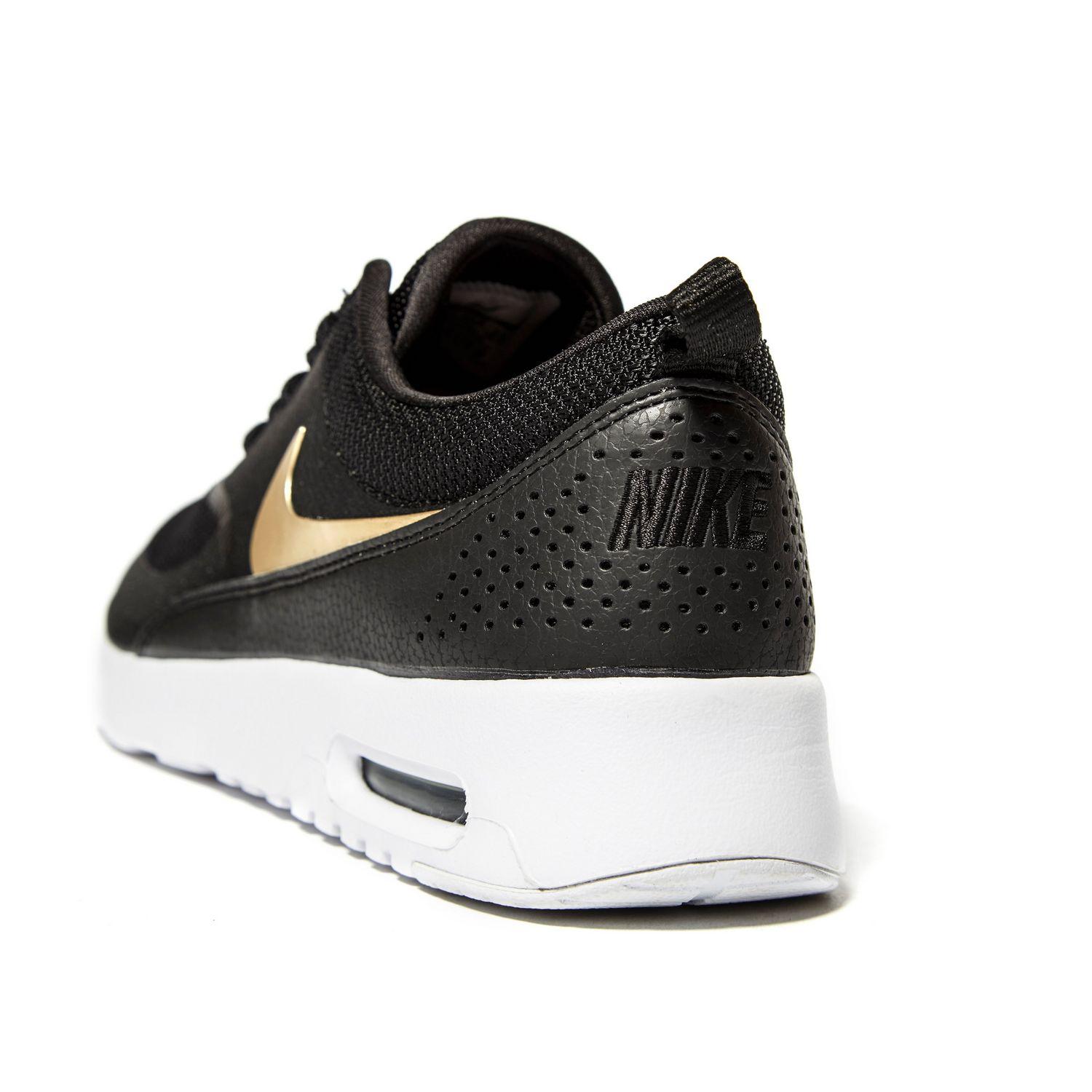 black and gold nike air max thea