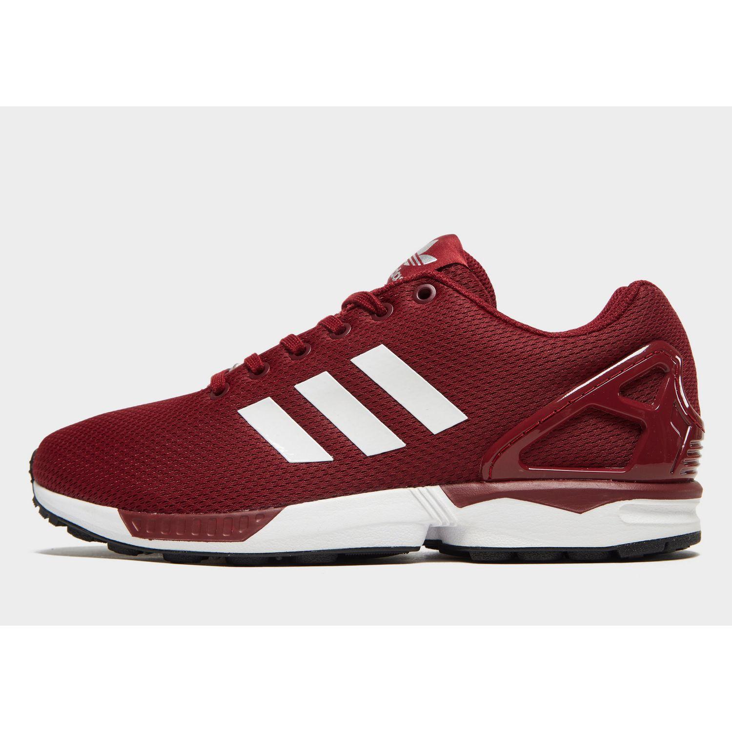 red adidas flux trainers