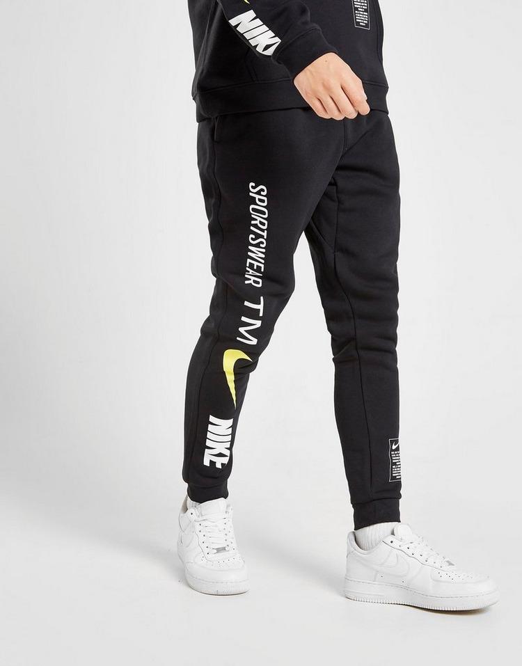 nike overbranded cuffed joggers in black