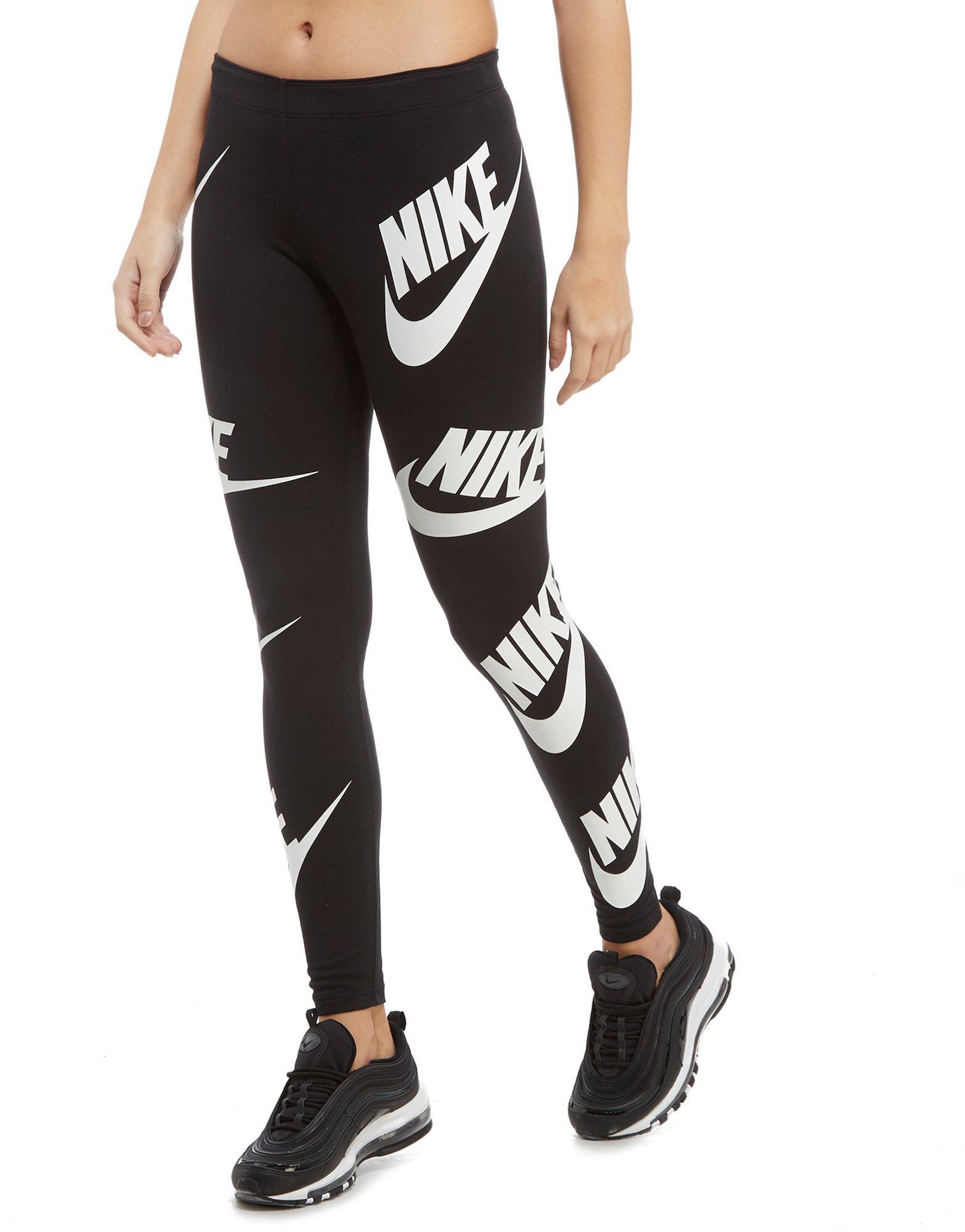nike tights with nike logo all over