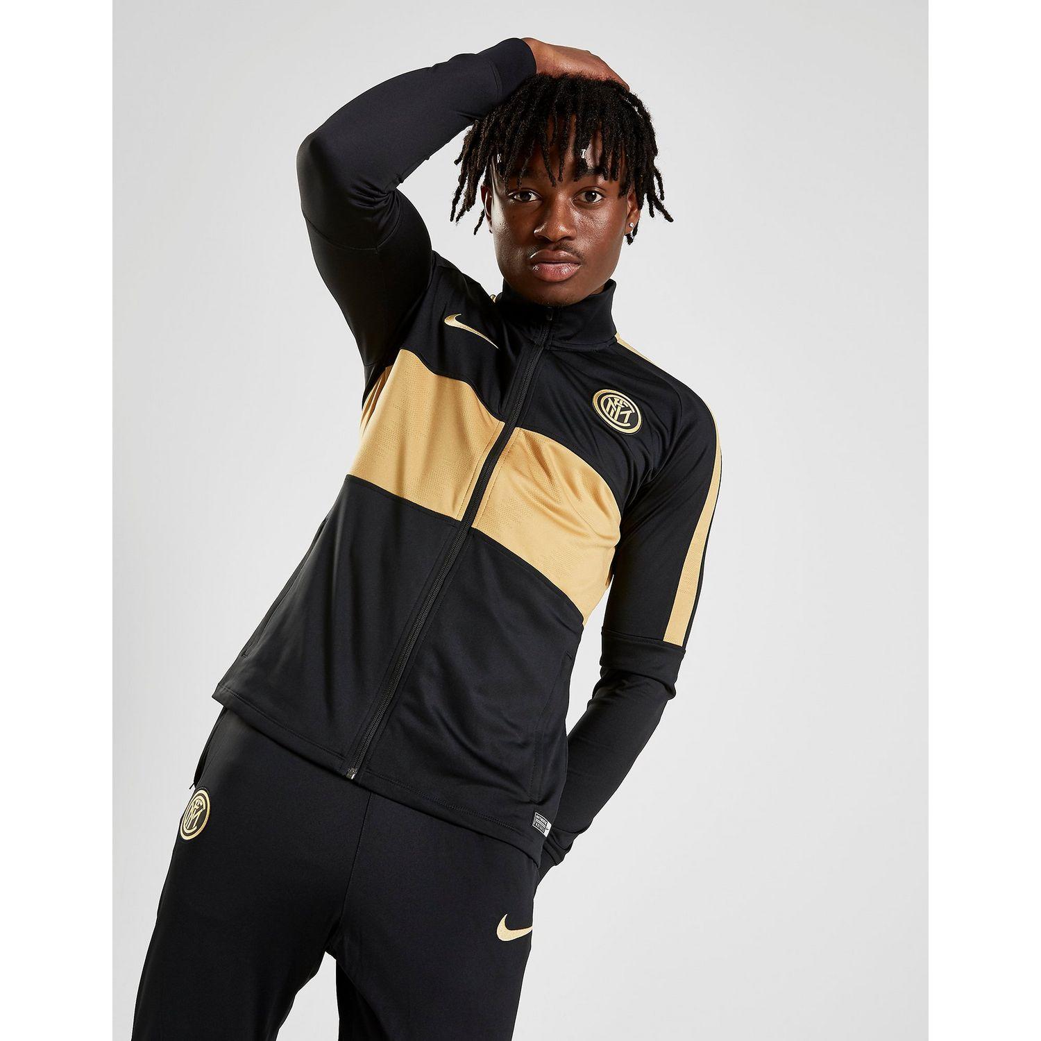 nike tracksuit black and gold