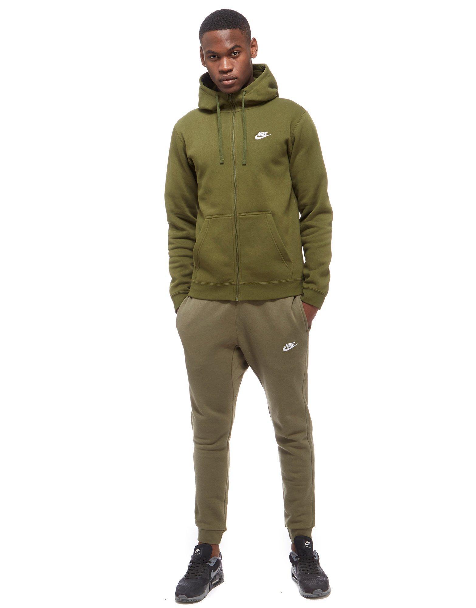 green and grey nike tracksuit