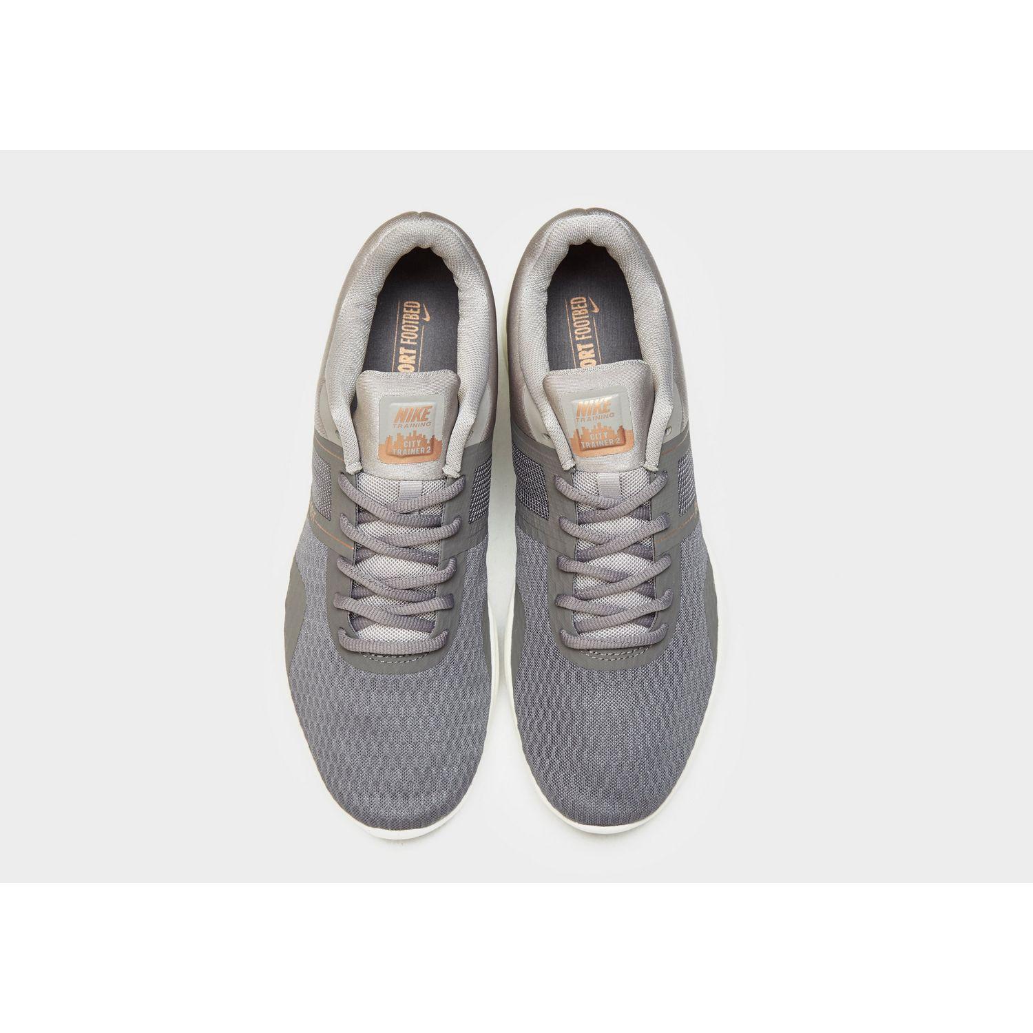 nike grey and gold trainers