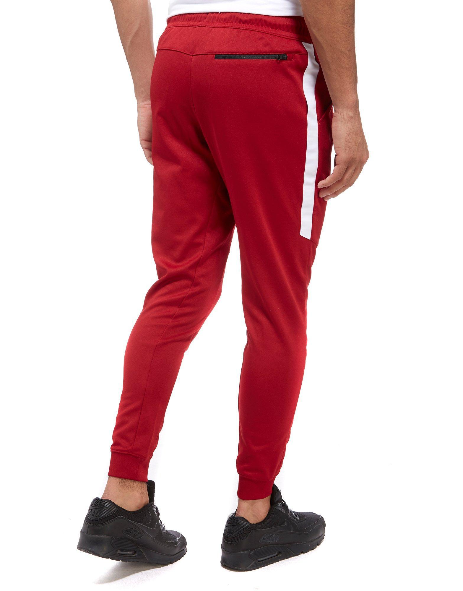 red nike tracksuit bottoms