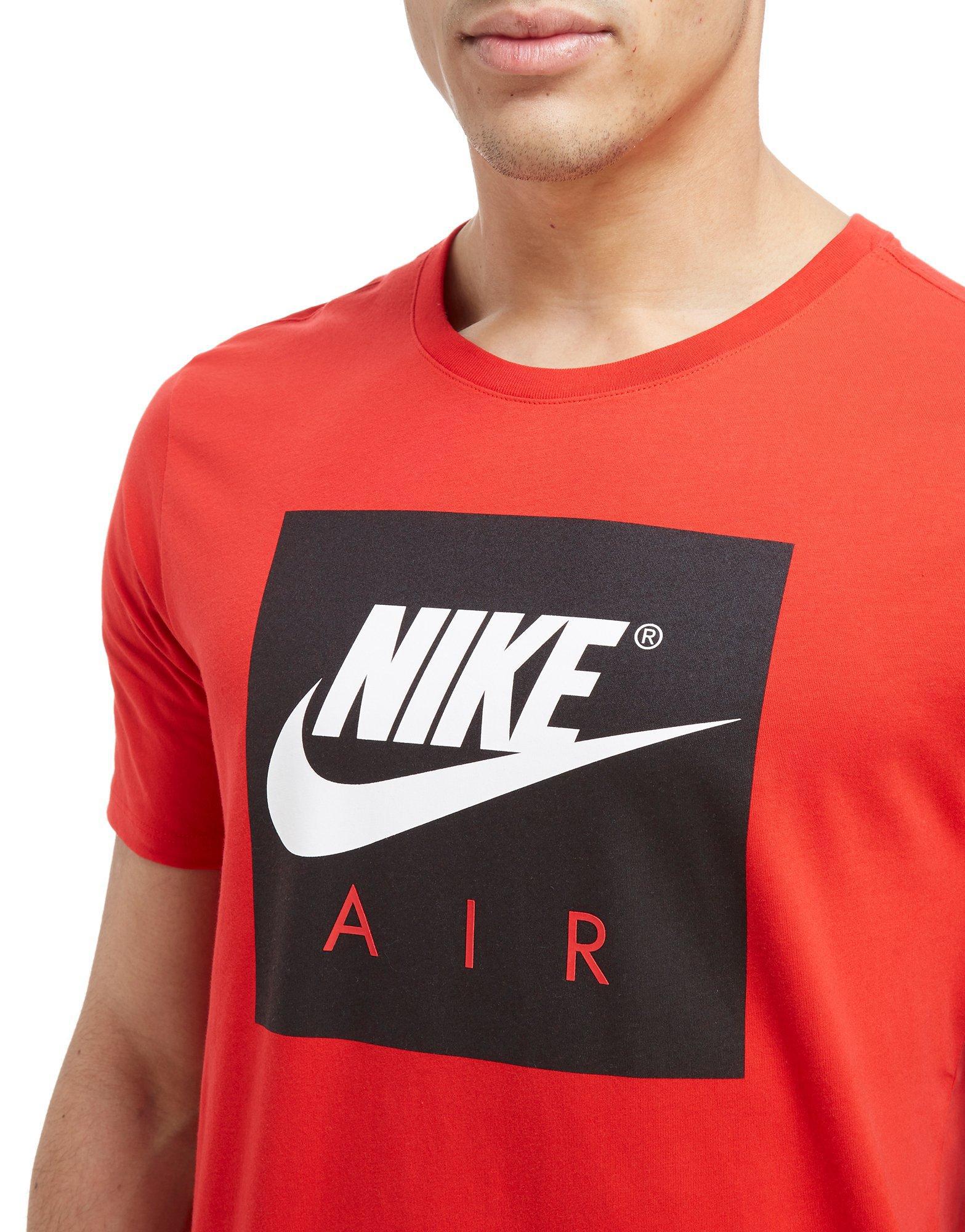 black nike shirt with red logo