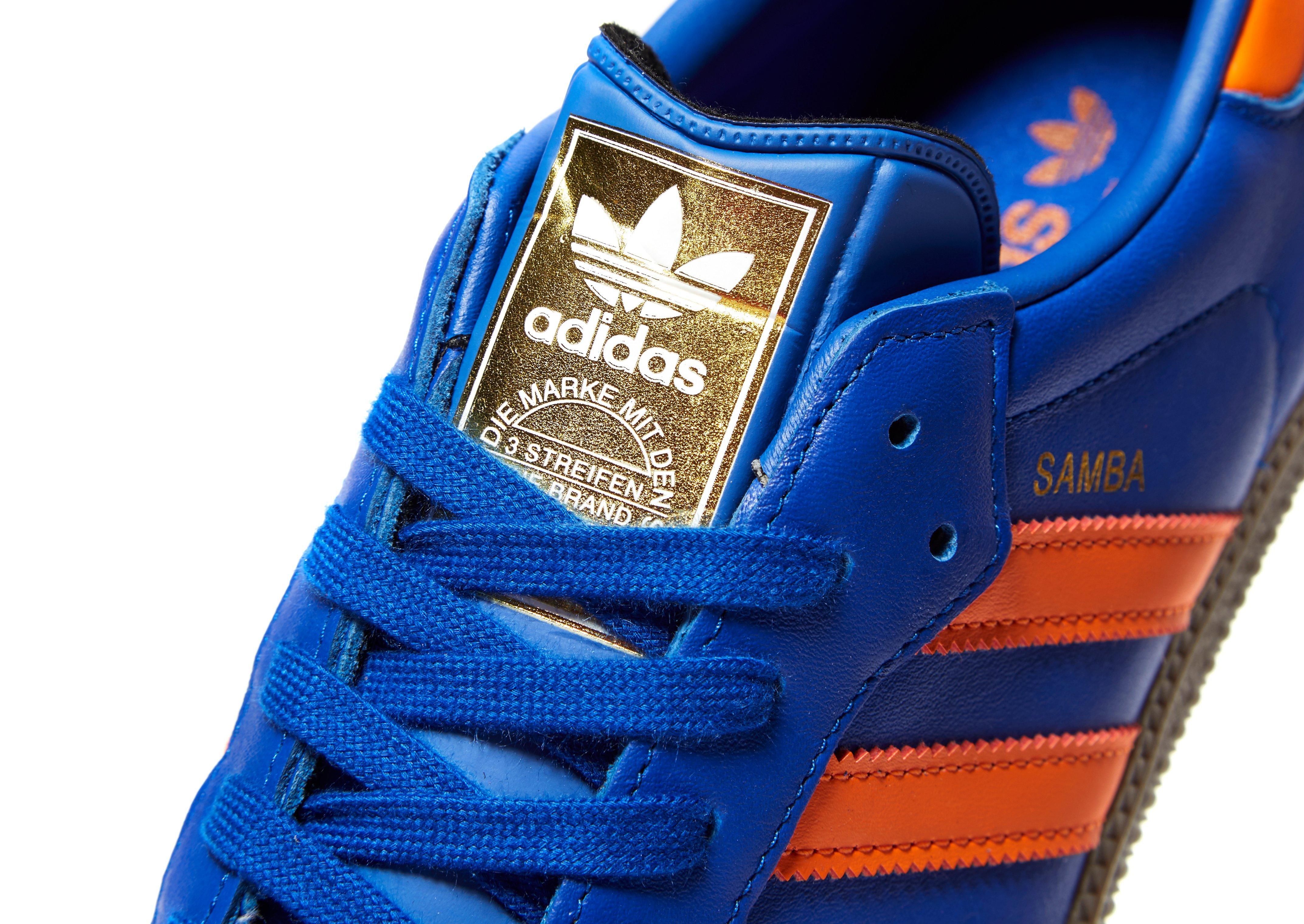 blue and orange adidas samba