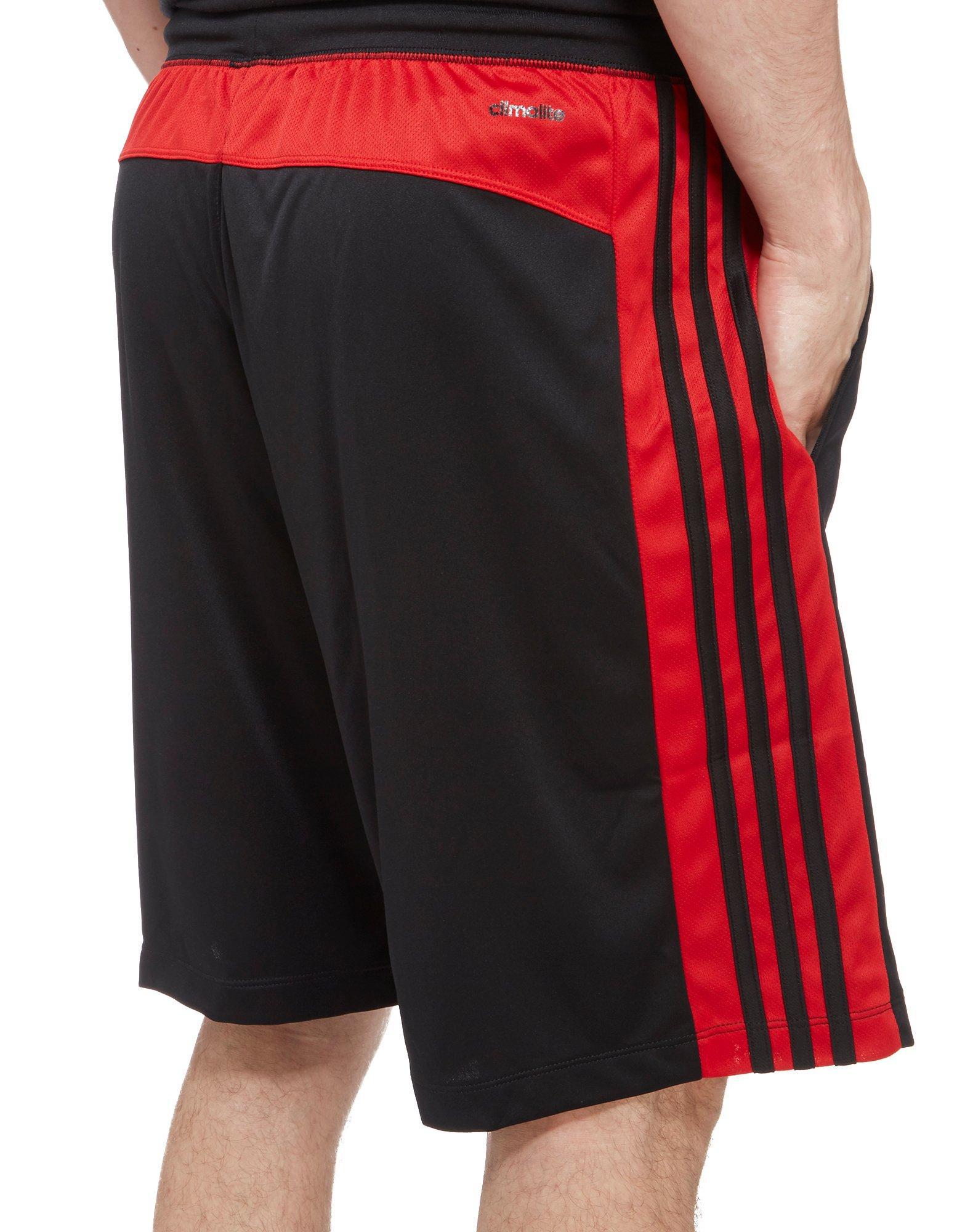 black adidas shorts with red stripes