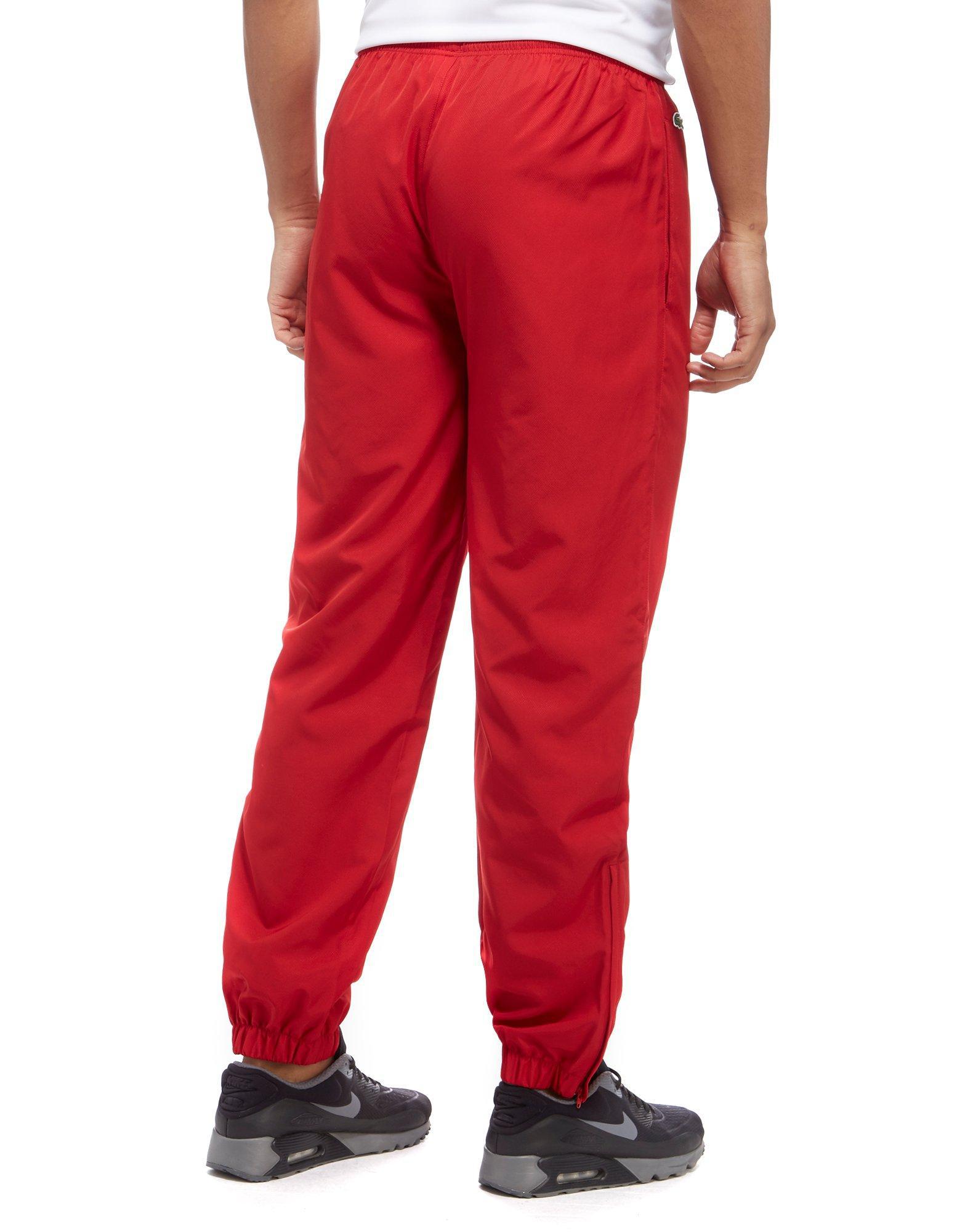 red lacoste track pants
