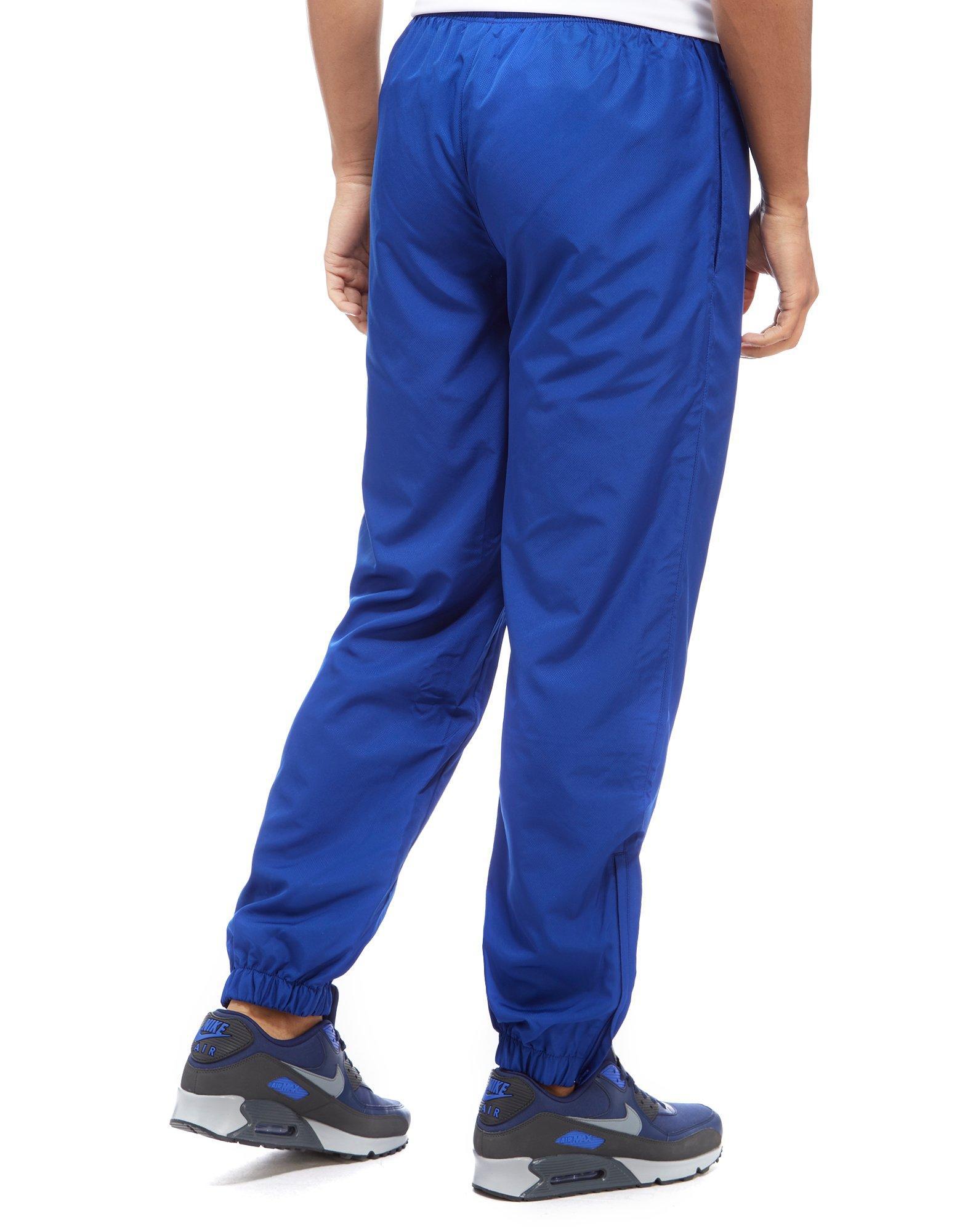 blue lacoste guppy pants