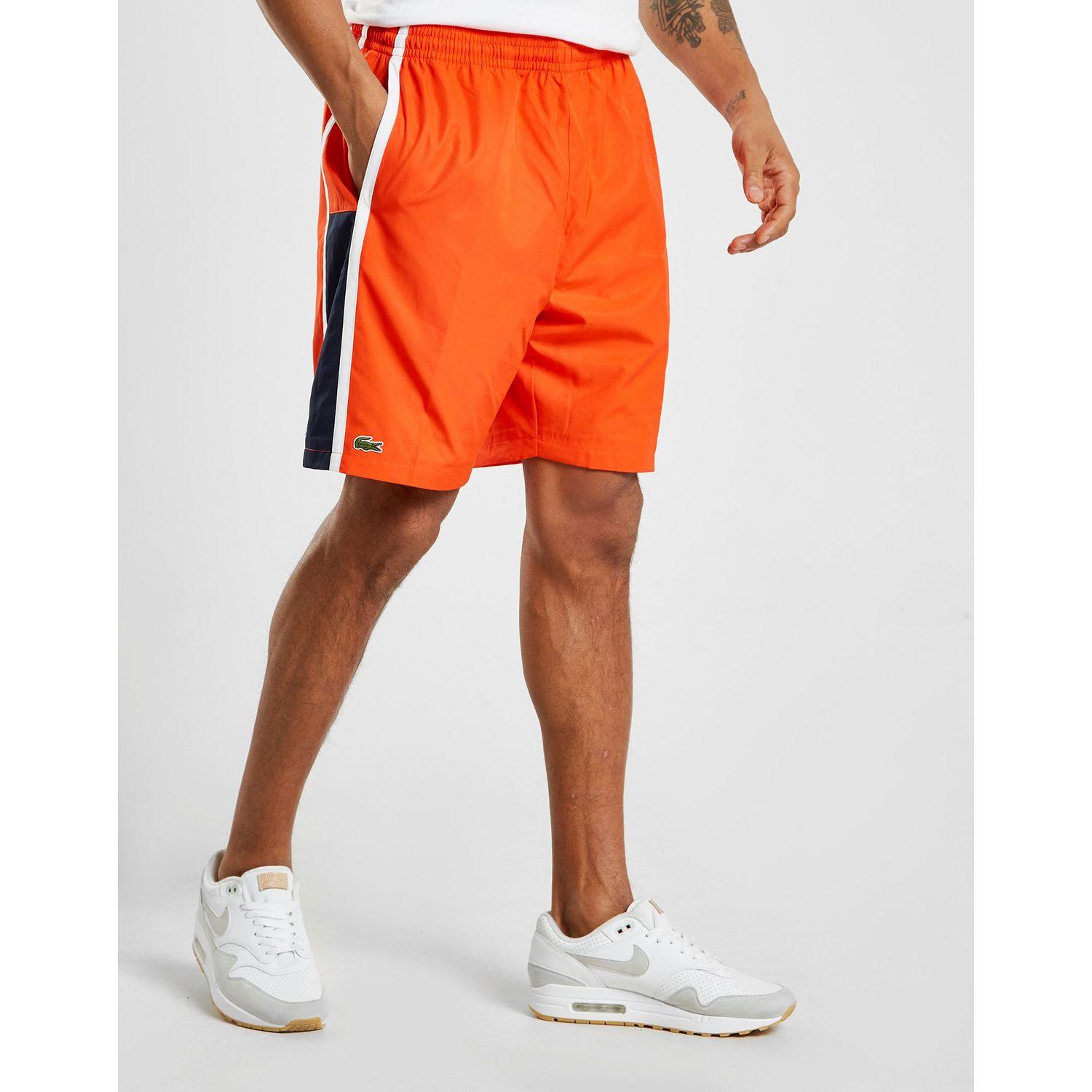 orange lacoste shorts