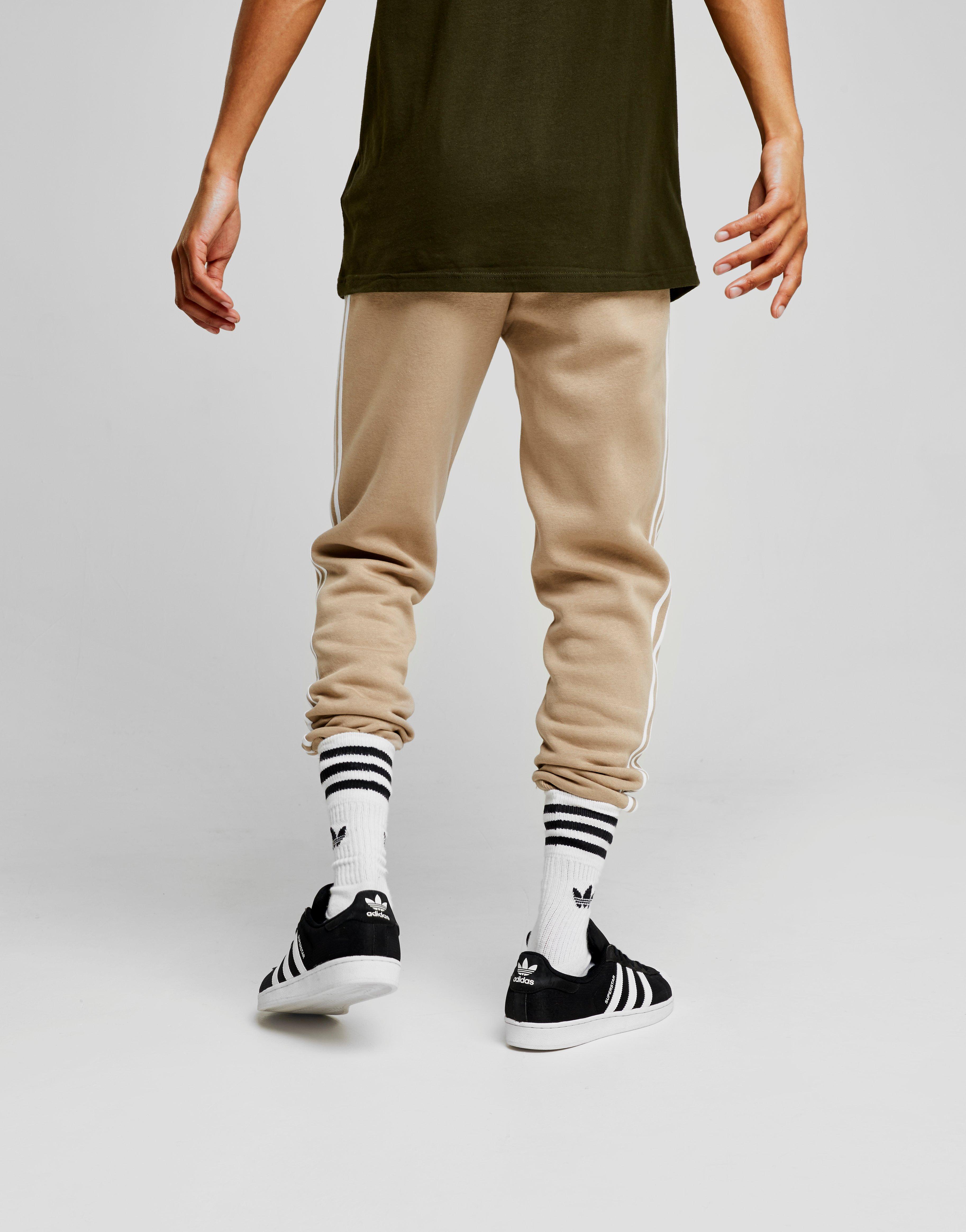 brown adidas tracksuit bottoms
