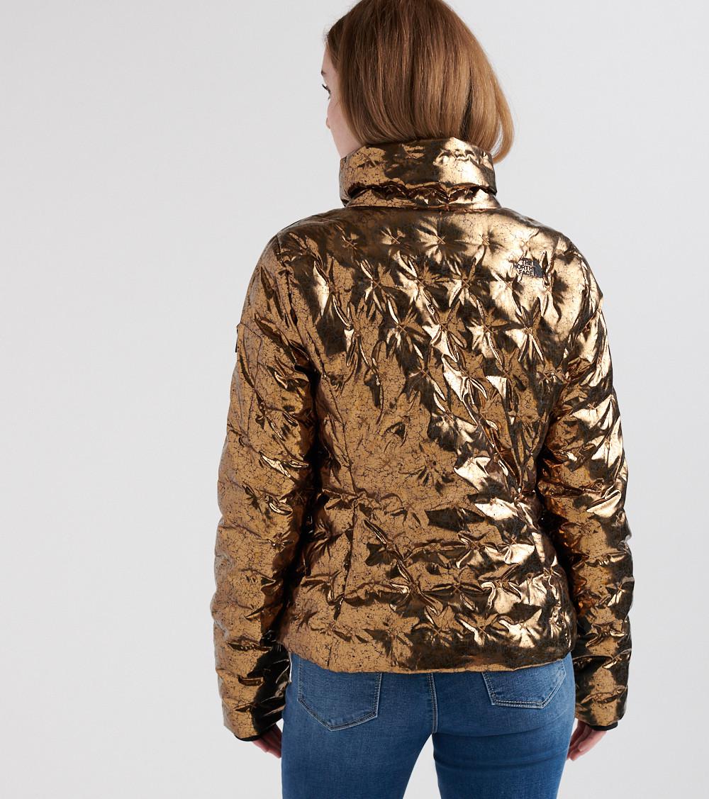 gold north face vest