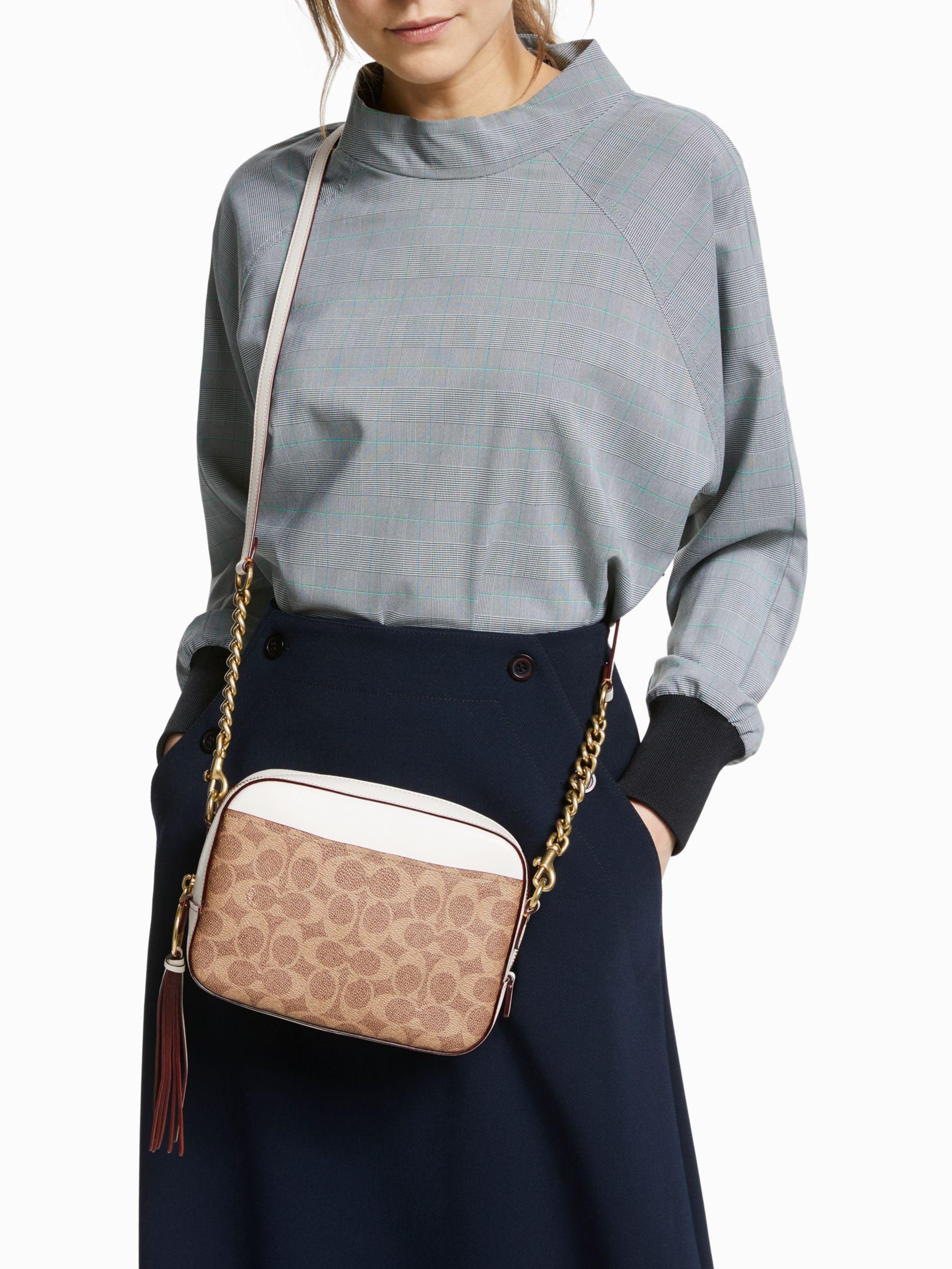 coach camera bag signature