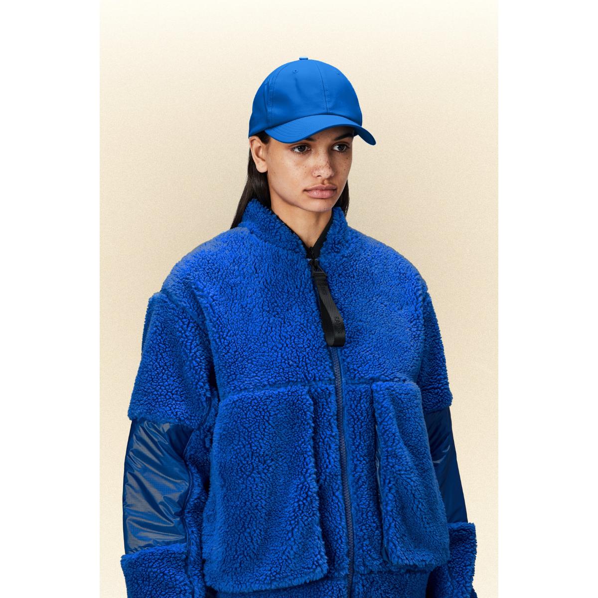 Rains Cap Waves in Blue Lyst