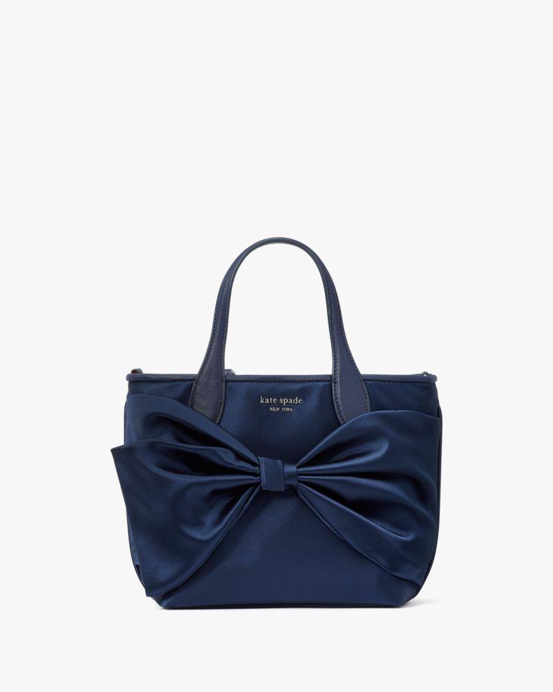 Kate spade black purse with white bow hotsell