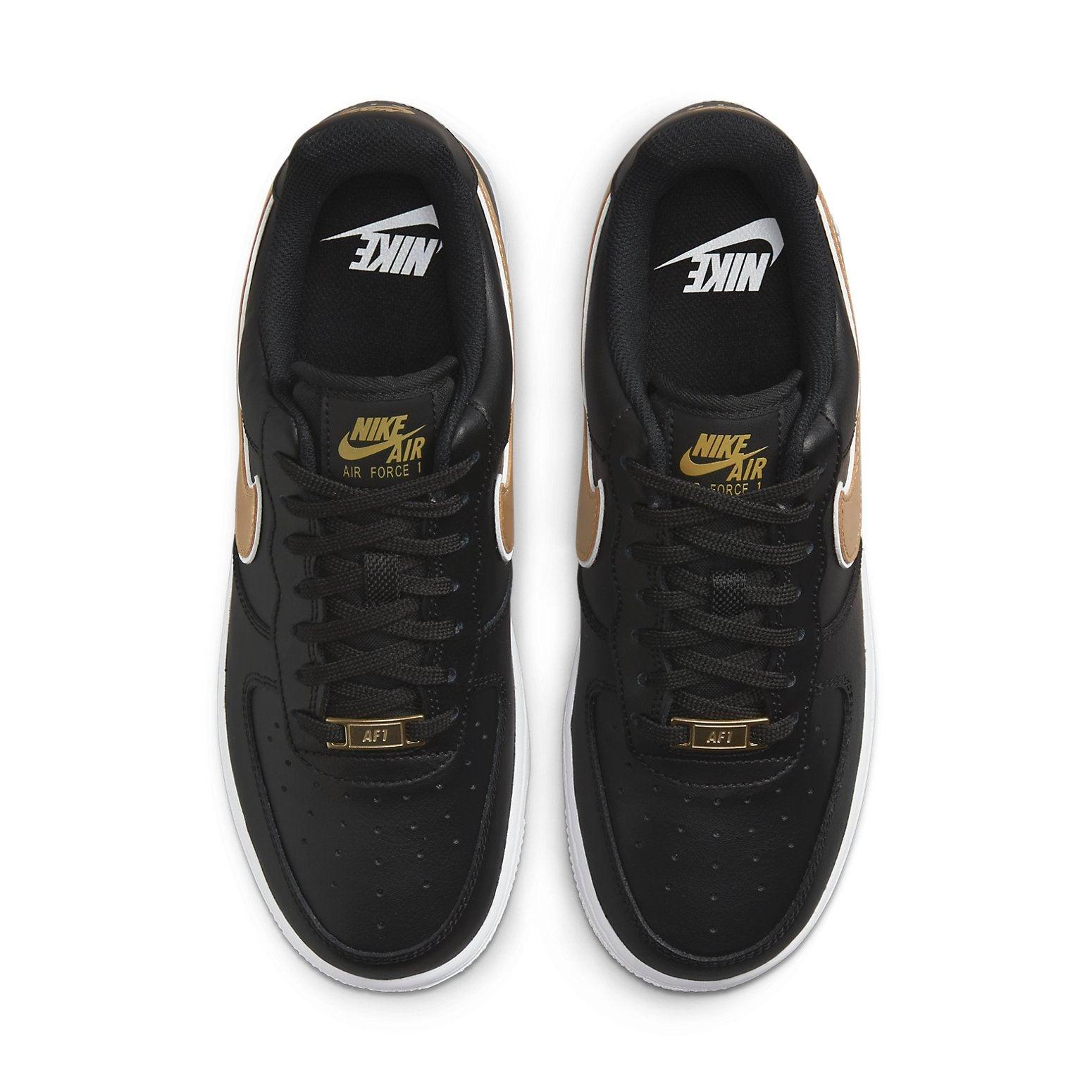 black nike shoes with gold check