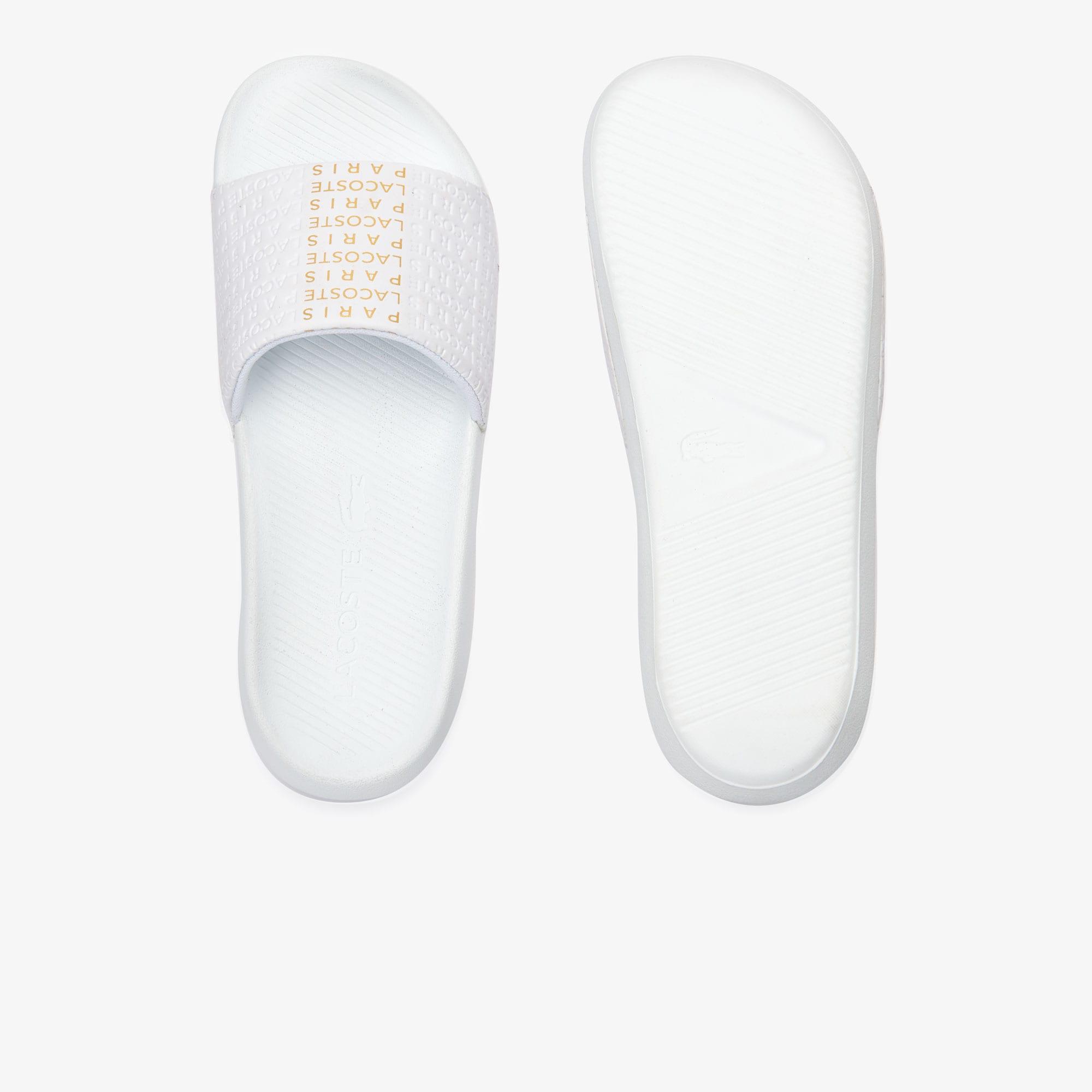white and gold lacoste slides