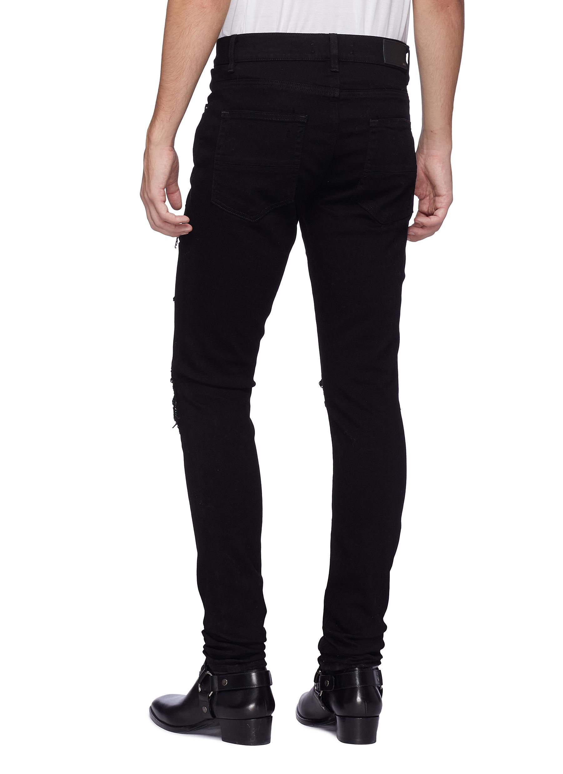 ripped jeans with bandana patches