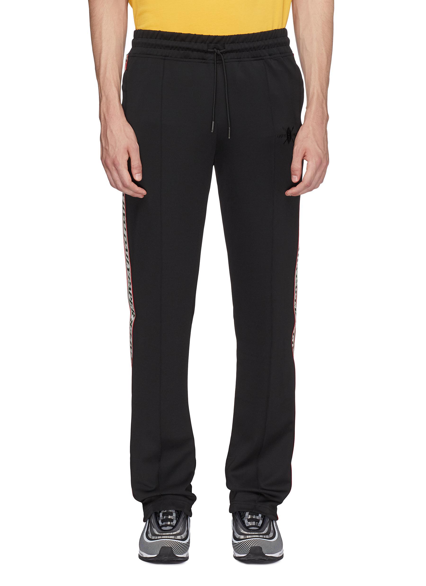 Daily Paper 'liba' Logo Tape Outseam Pintucked Track Pants in Black for Men  | Lyst