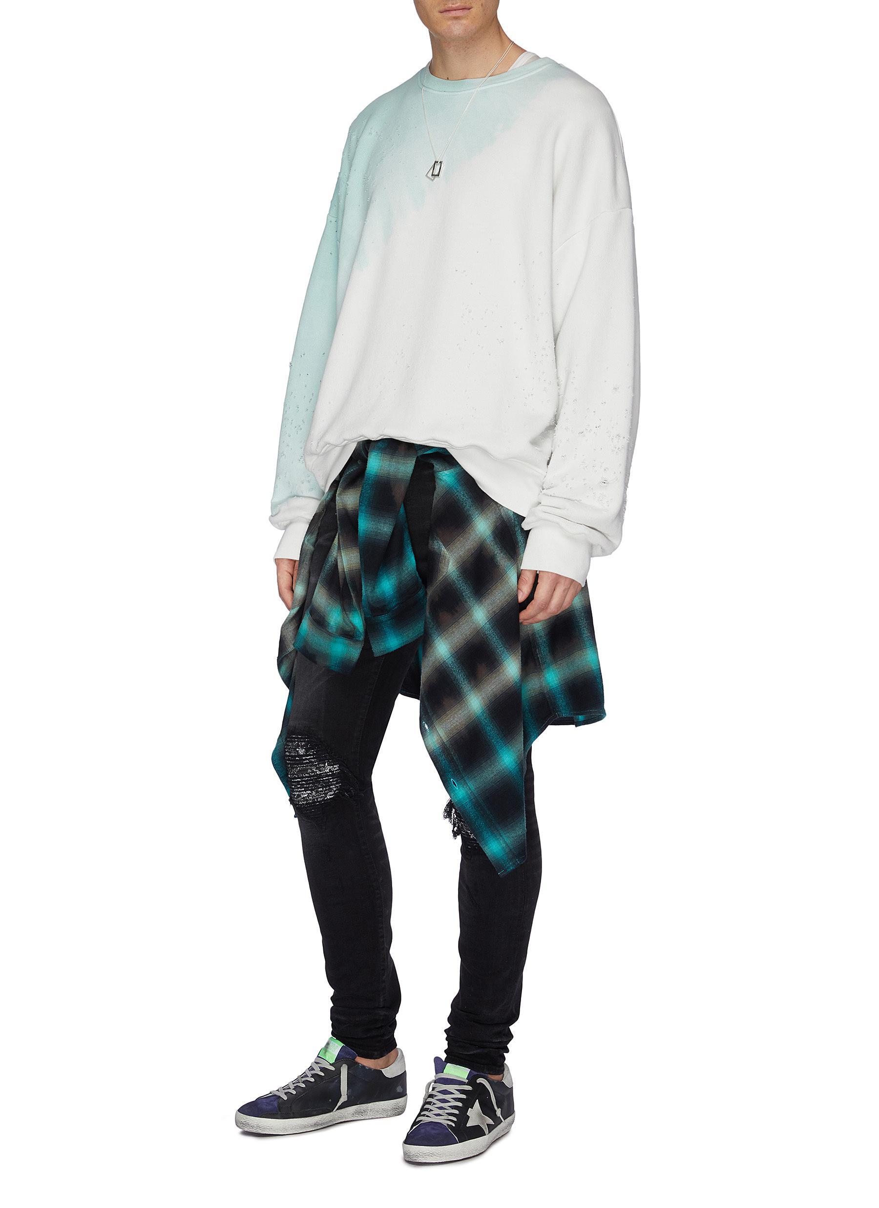 ripped jeans with bandana patches