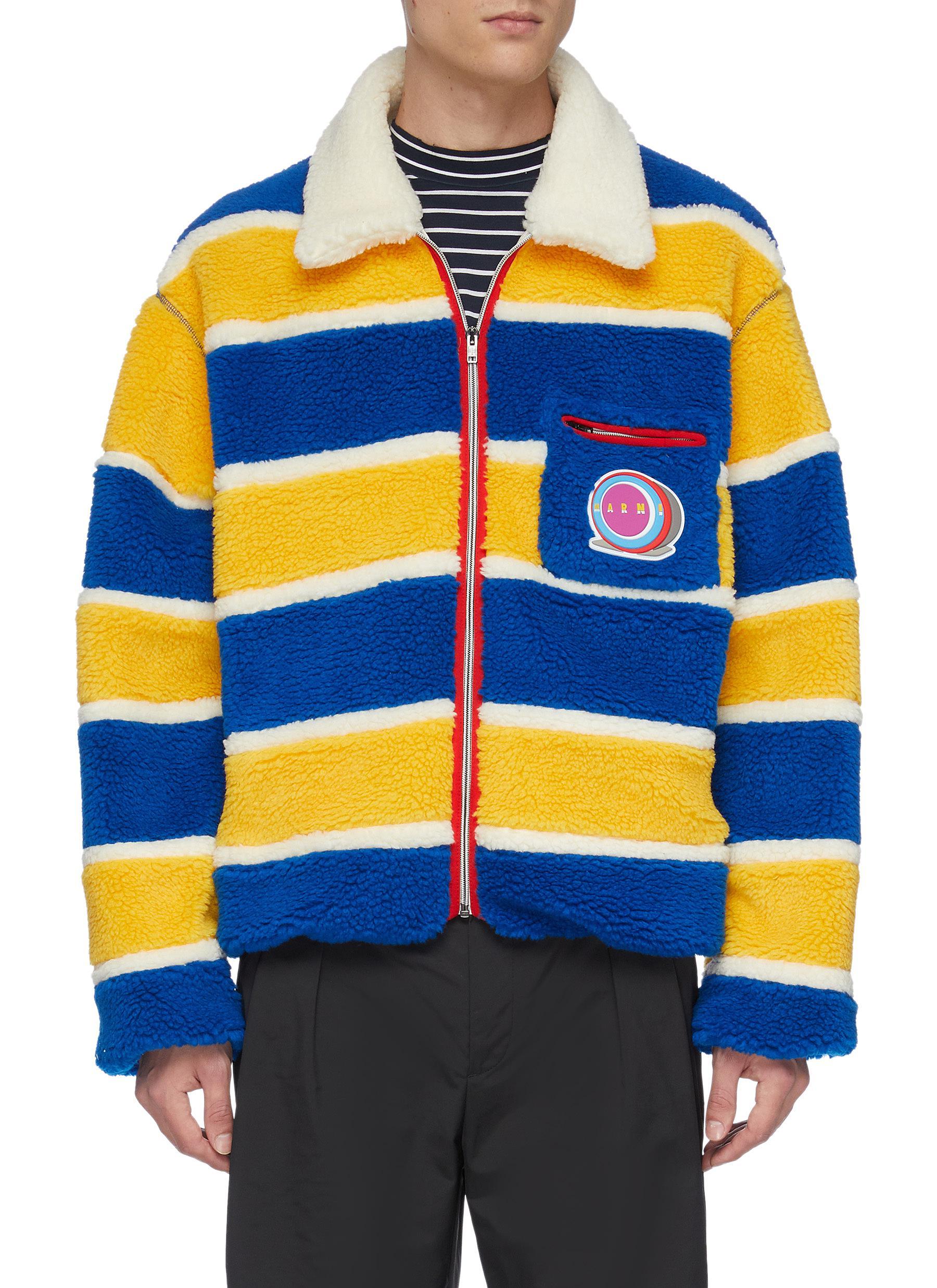 blue jacket with yellow stripes