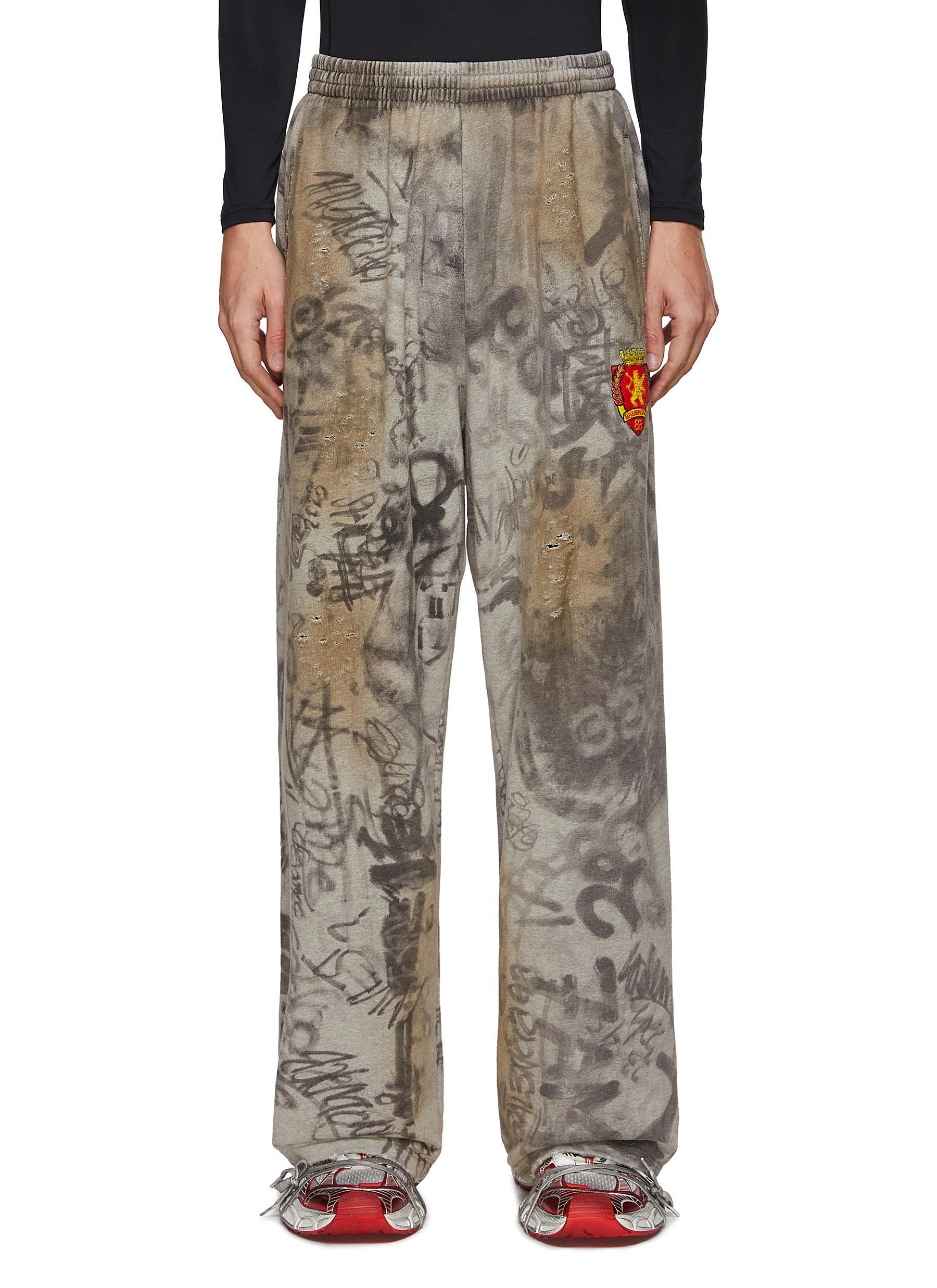 Balenciaga All Over Graffiti Print Ripped Baggy Sweatpants in Gray for ...
