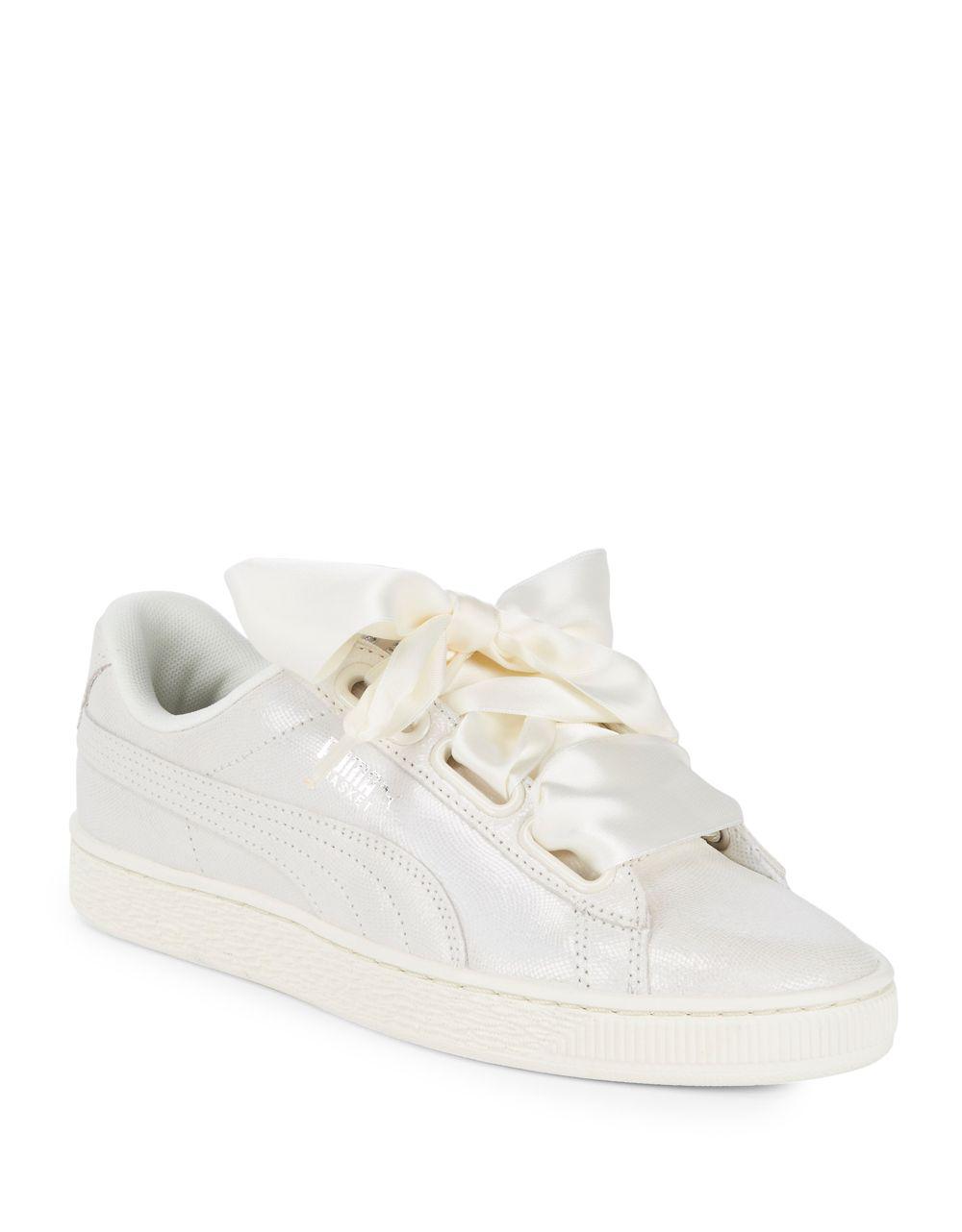 white pumas with ribbon laces
