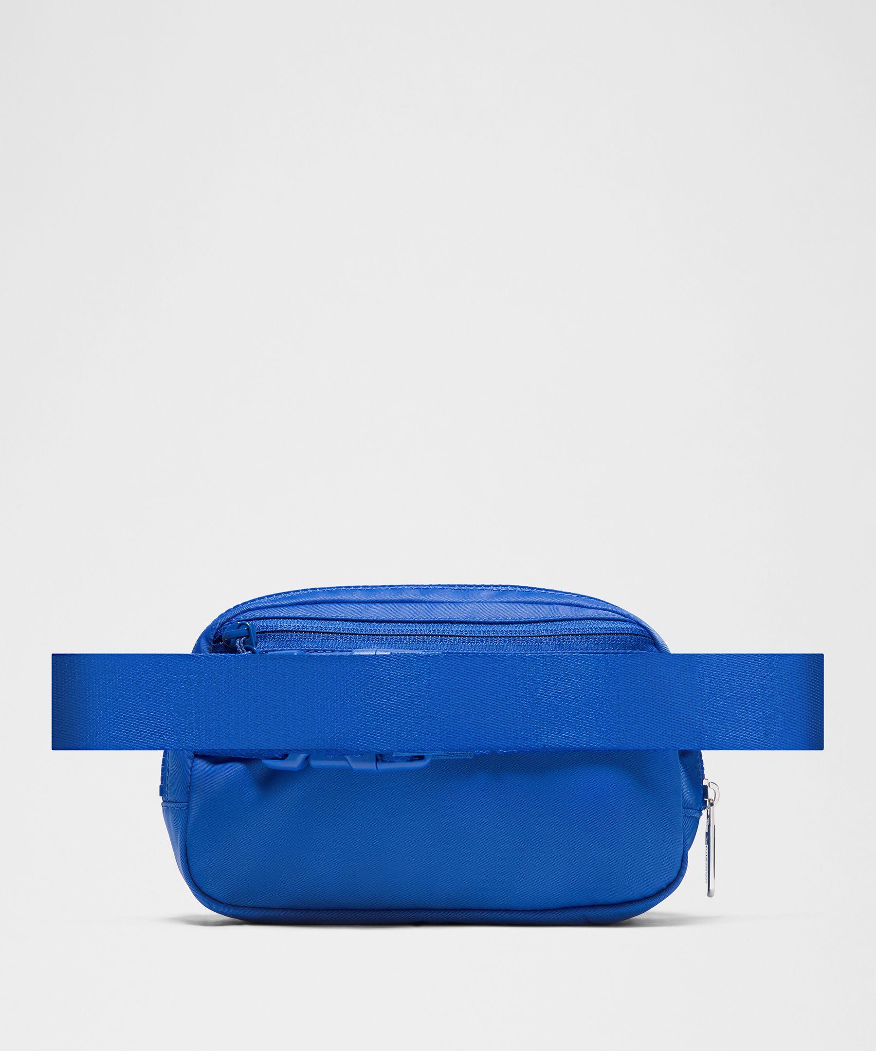 blue lululemon belt bag Everywhere Wordmark Crossbody 1L Tuck The Excess Belt Bag Strap Into The Elastic Loops lululemon Solid Everywhere Belt Bag