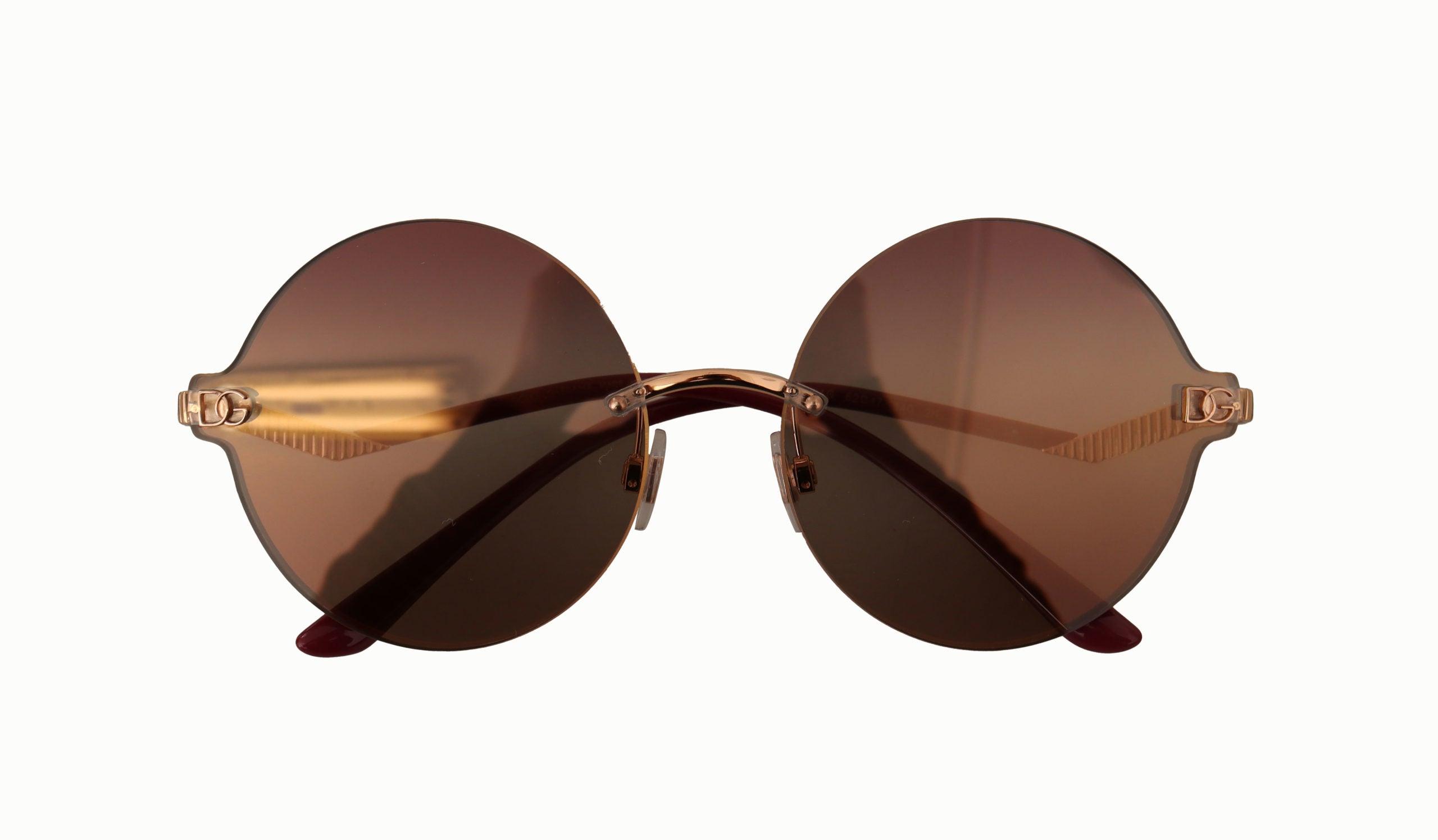 Dolce & Gabbana Frame Brown Lens Round Rimless Sunglasses in Black | Lyst UK