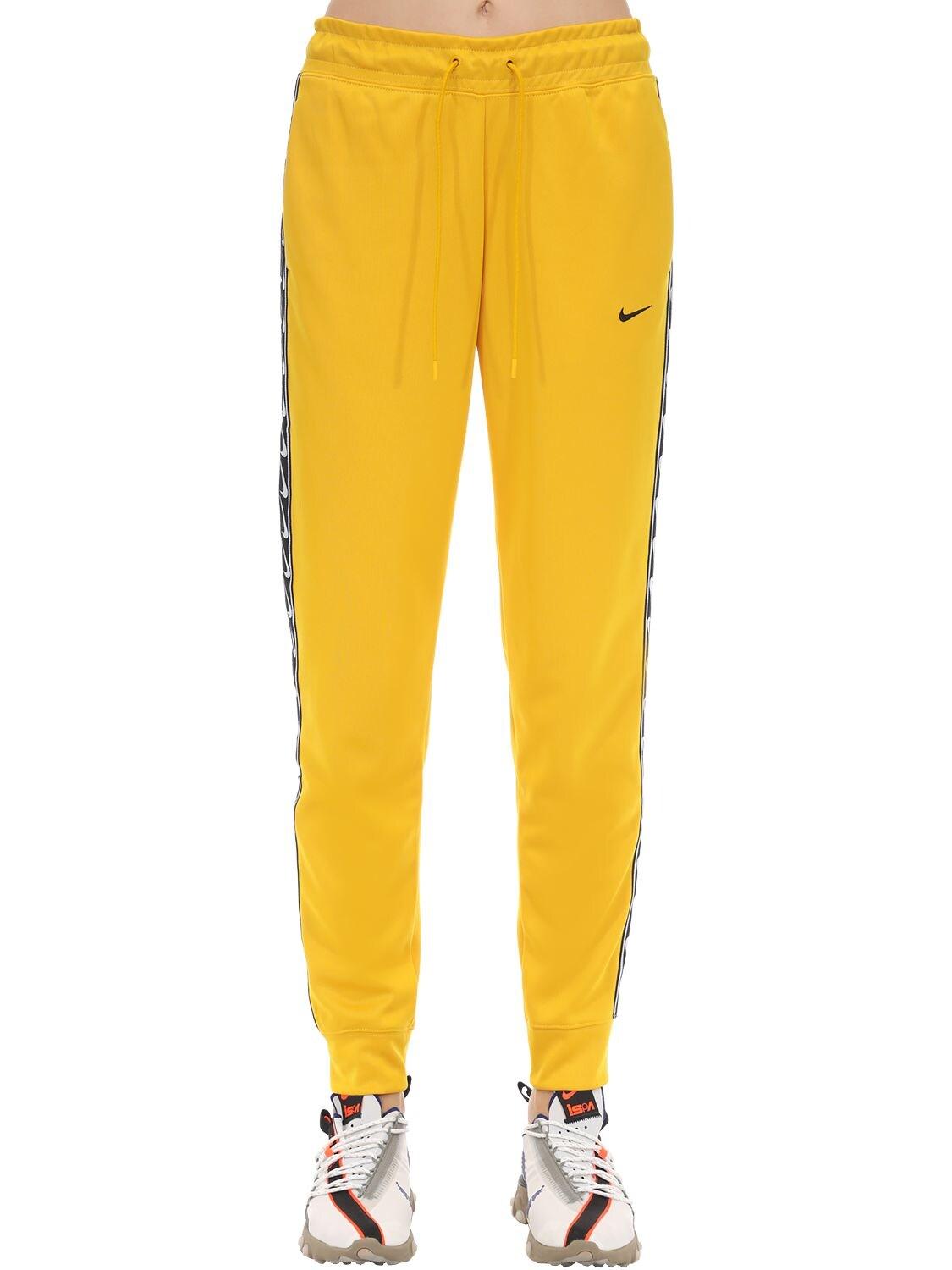 Nike Jogger Logo Tape Sweatpants in Yellow | Lyst
