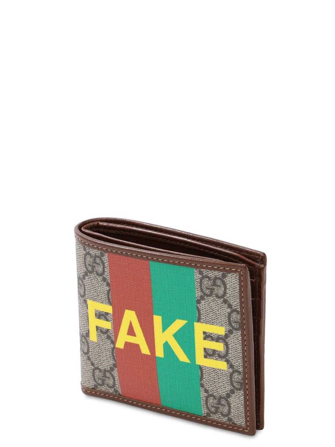 Portafoglio bi-fold con stampa 'Fake/Not' da Uomo di Gucci in Neutro | Lyst