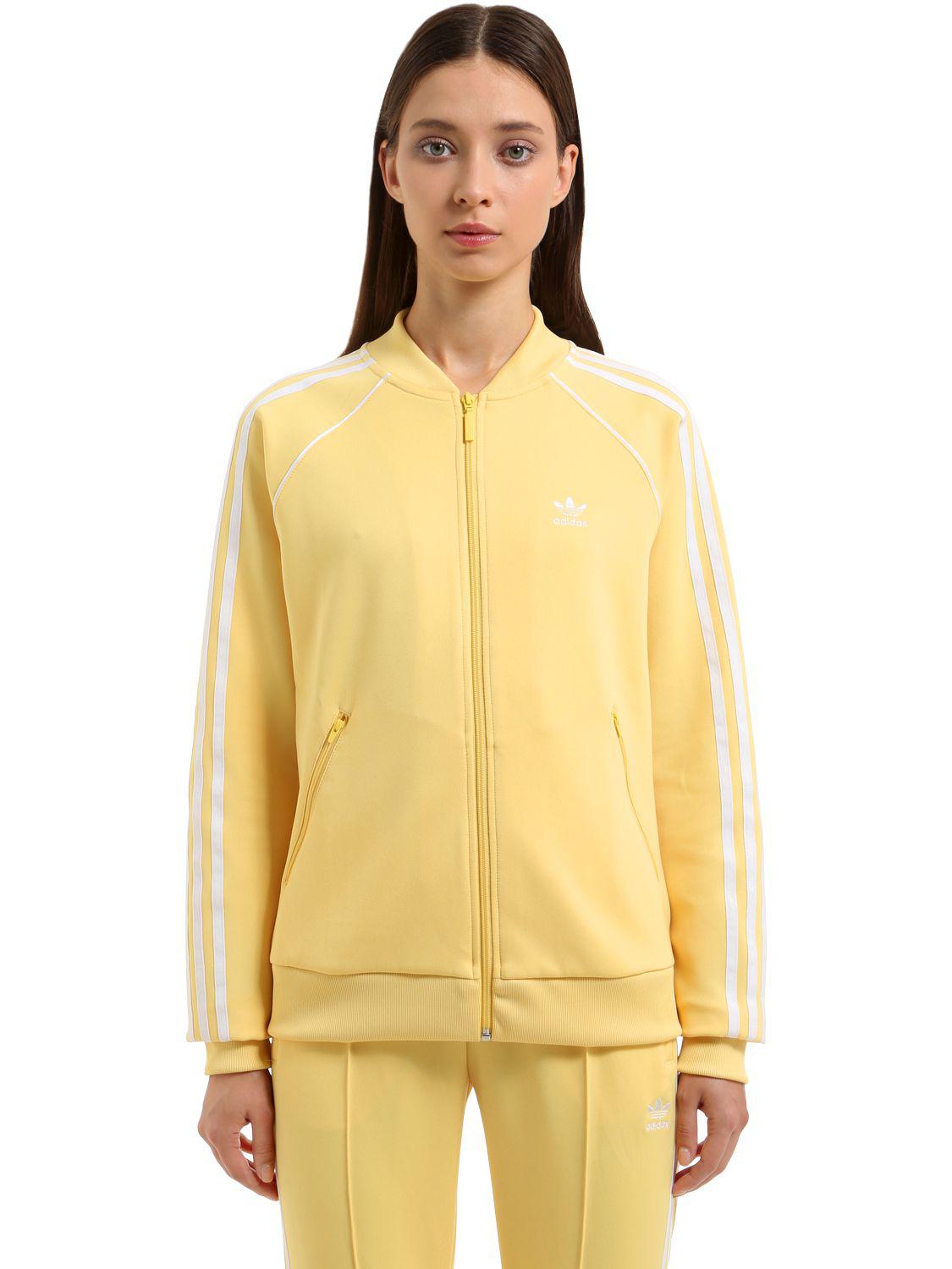 blue and yellow adidas tracksuit