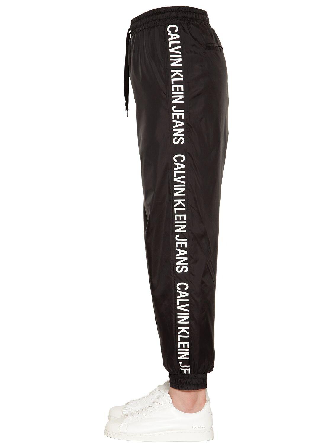 Calvin Klein Synthetic Logo Tape Nylon Track Pants in Black for Men - Lyst