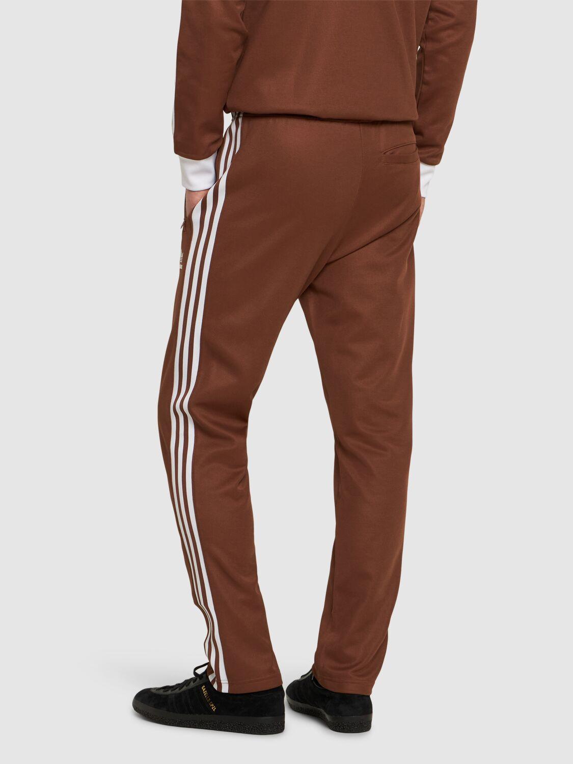 Brown adidas track pants hotsell