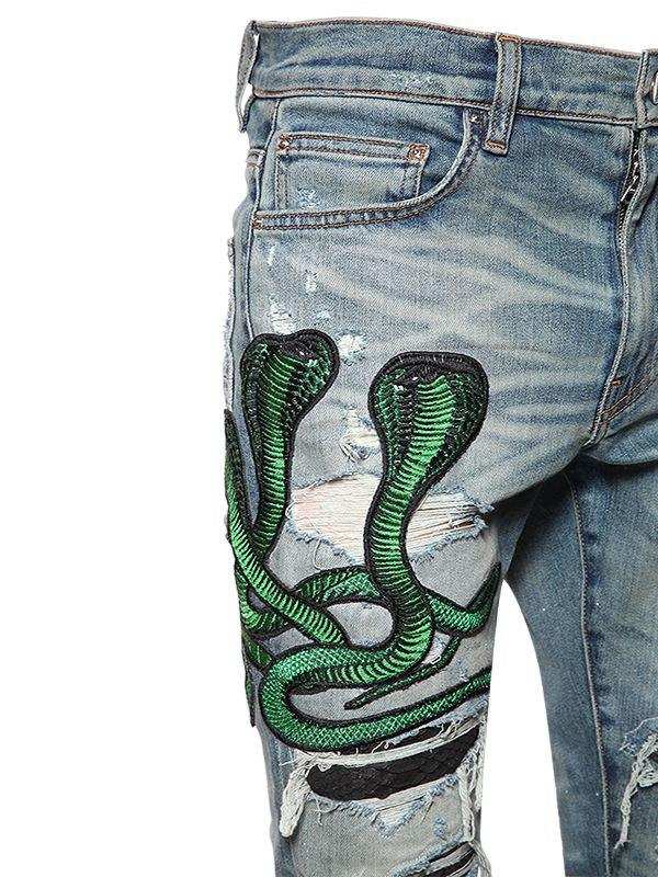 amiri green snake jeans