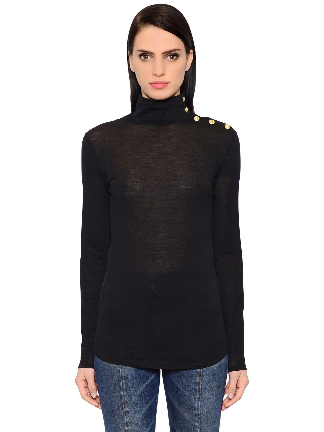 black sweater with gold buttons