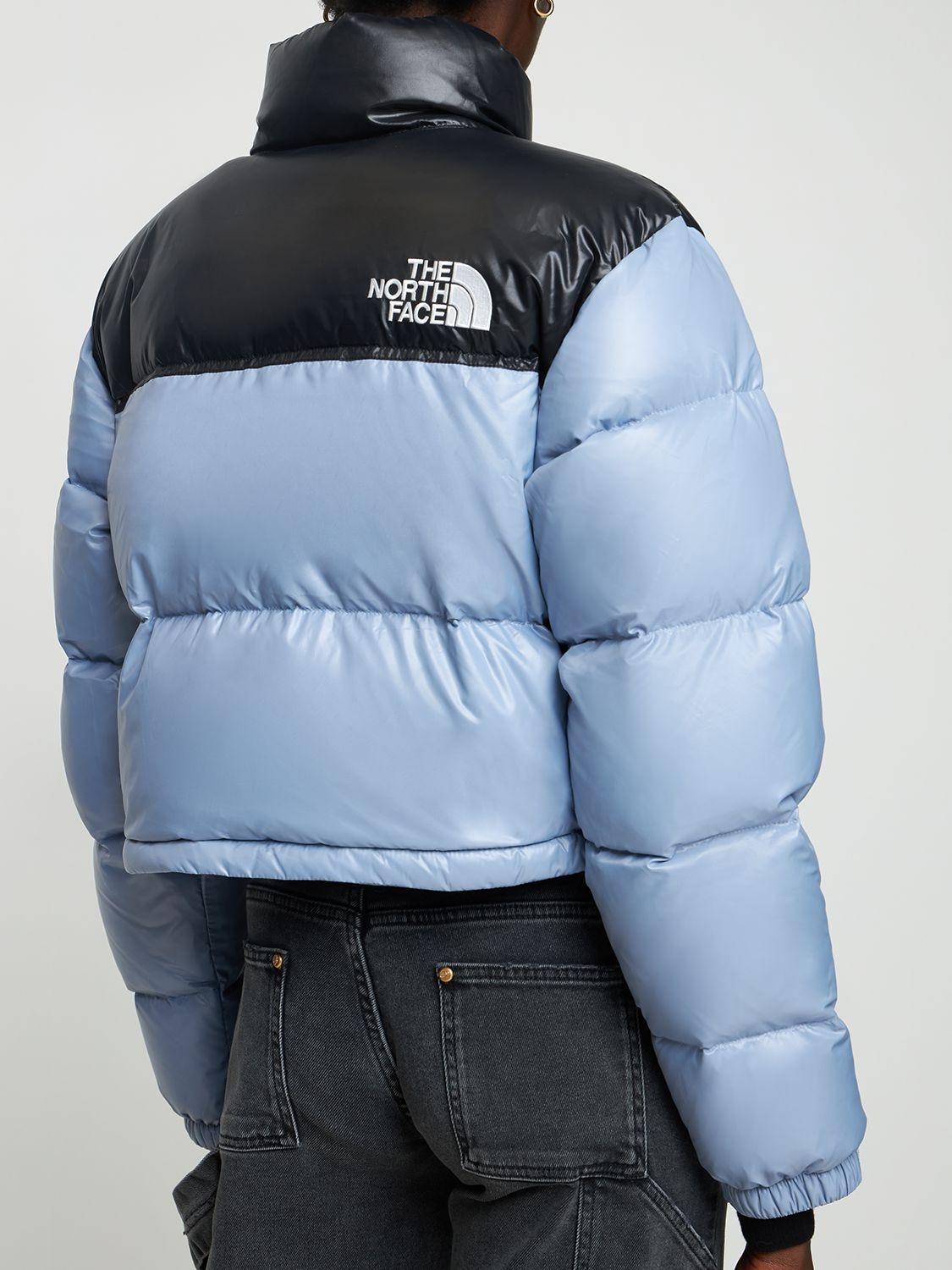 blue cropped north face jacket