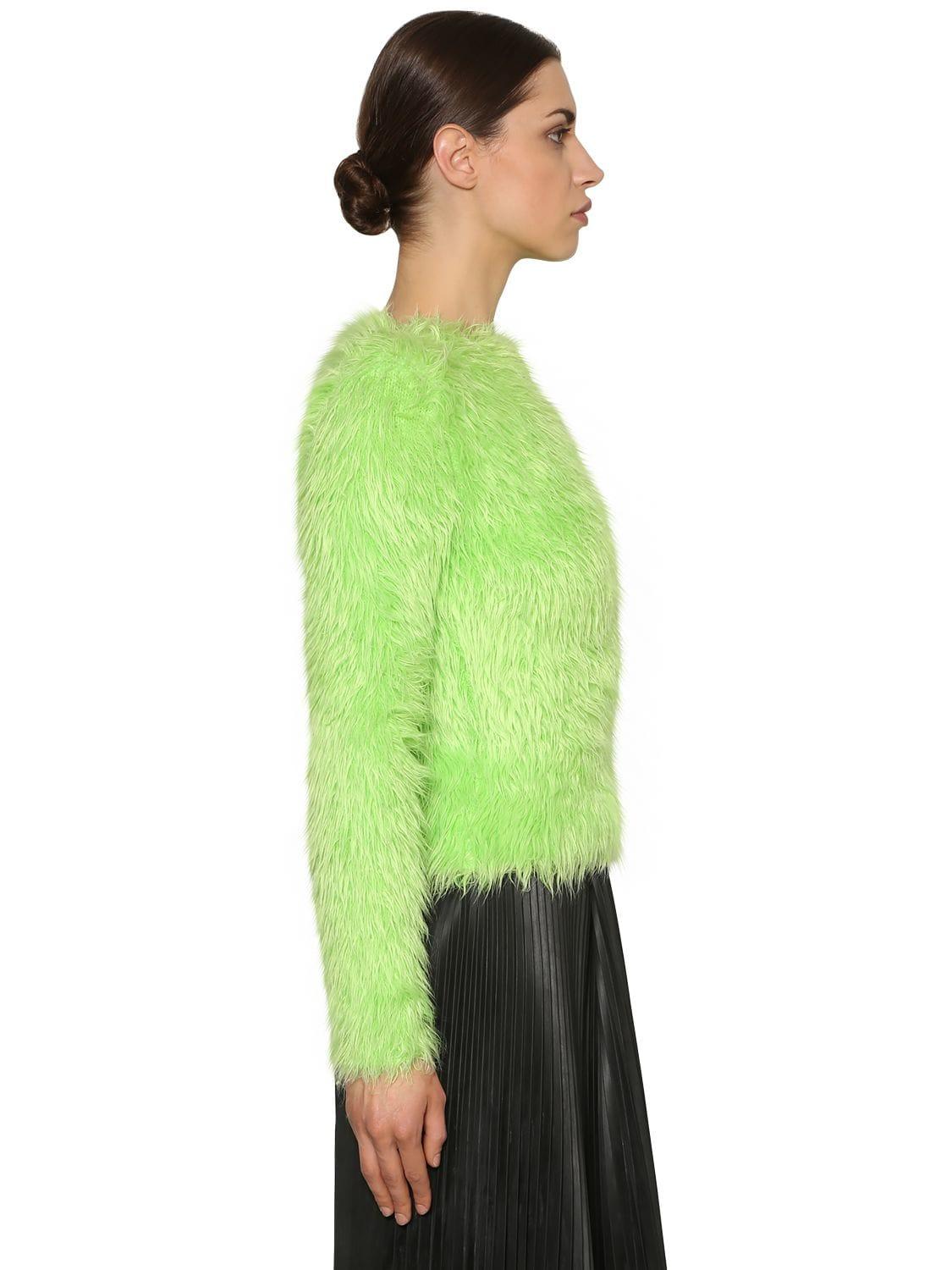 green fur sweater