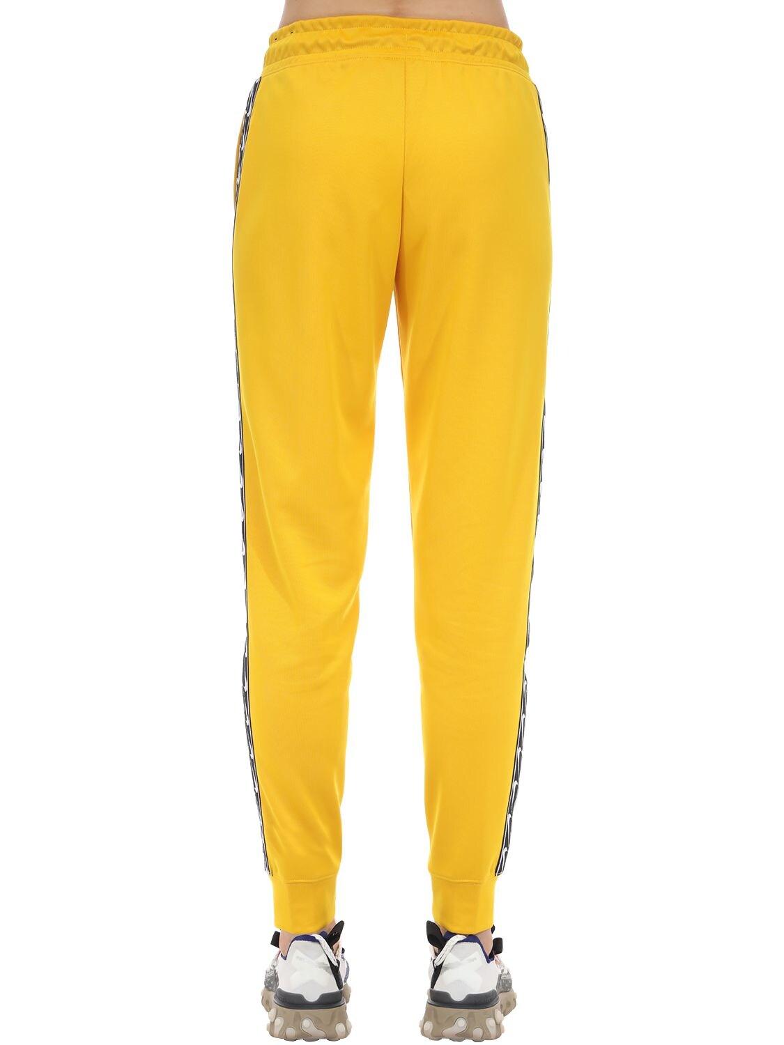 Nike Jogger Logo Tape Sweatpants in Yellow | Lyst