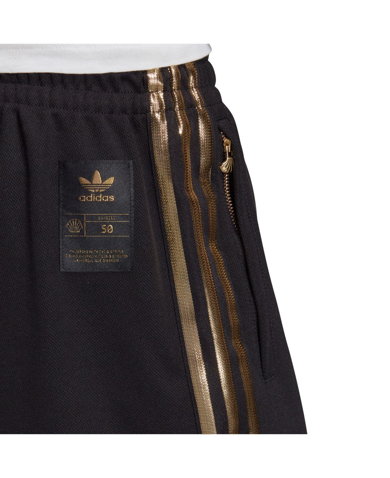 black and gold tracksuit adidas