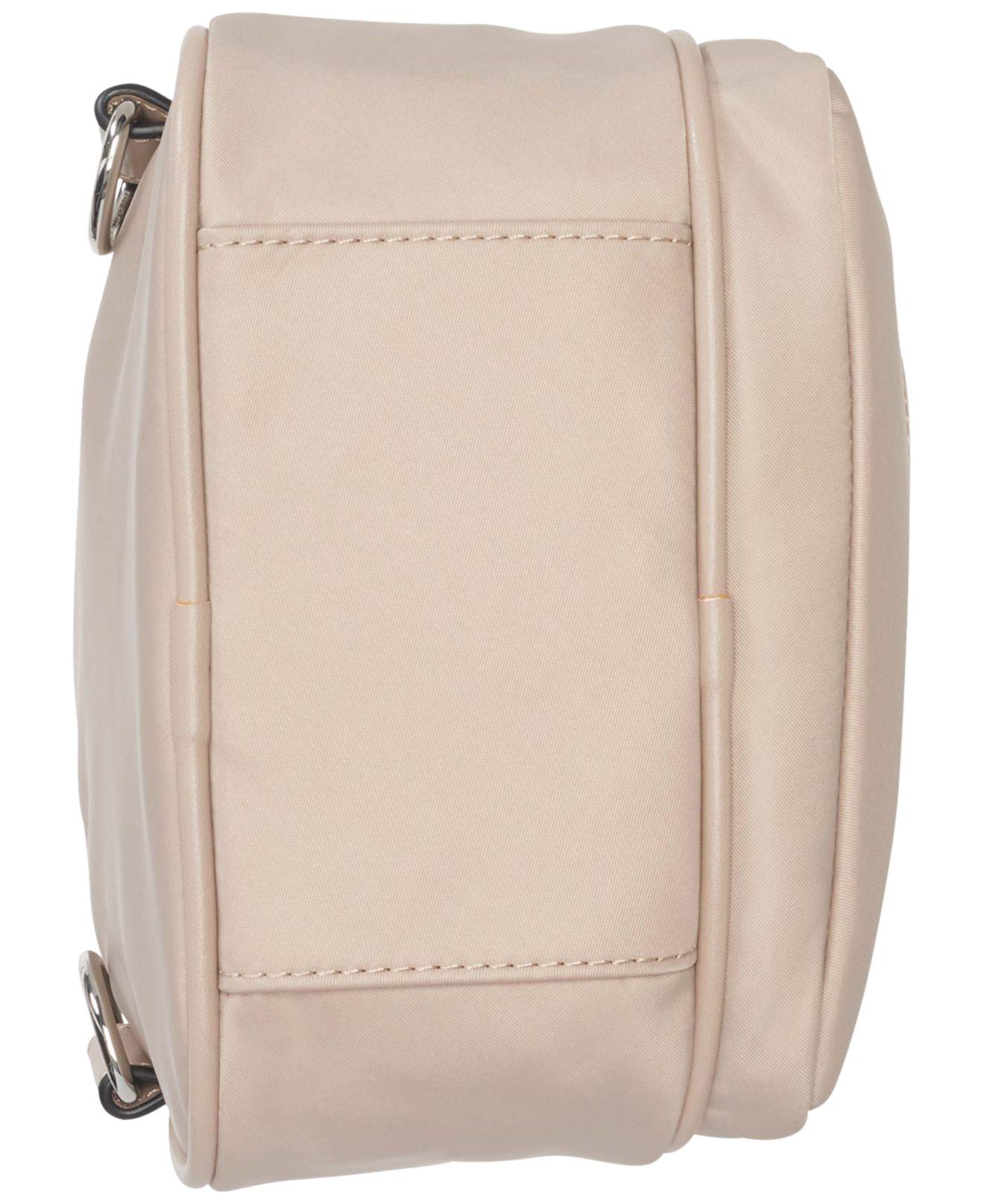 Calvin Klein Shay Nylon Top Buckle Sling Bag in Natural | Lyst