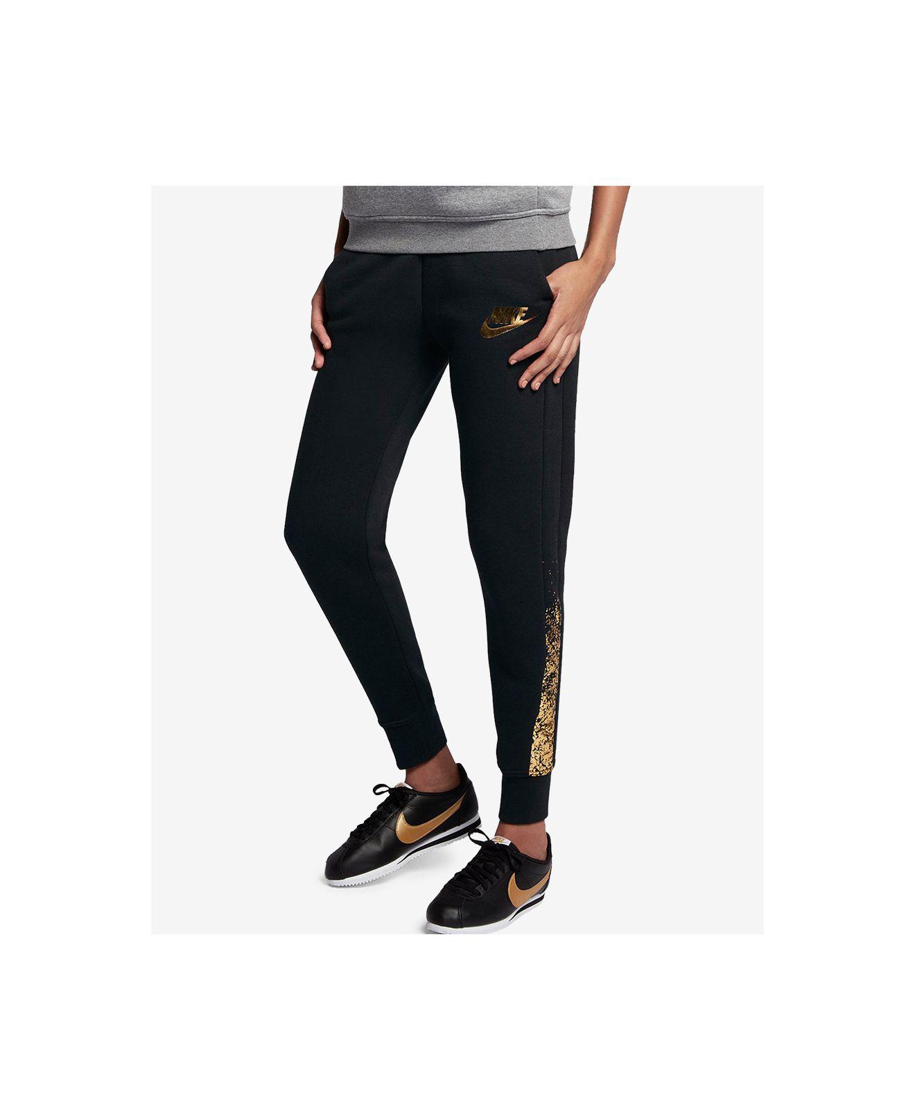 nike black and gold joggers