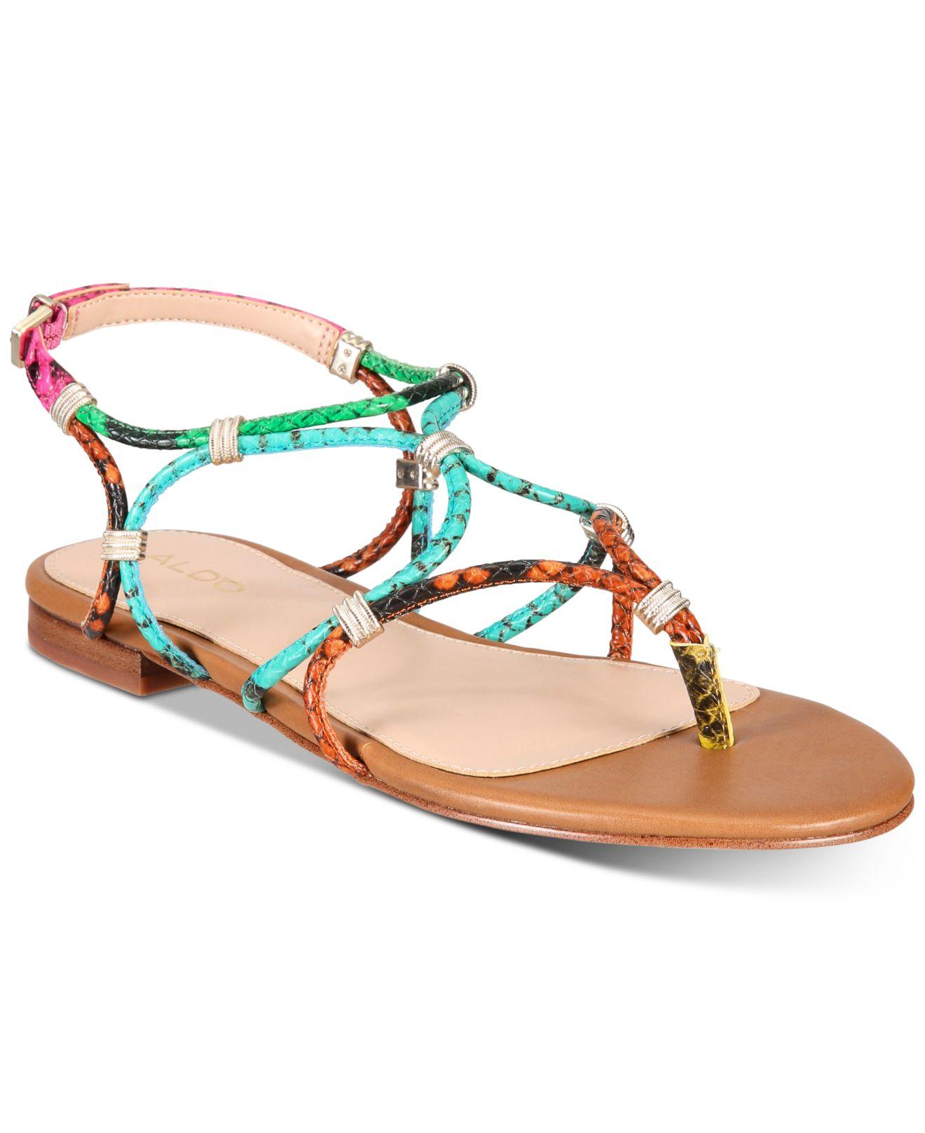 burgundy nike sandals with gold check